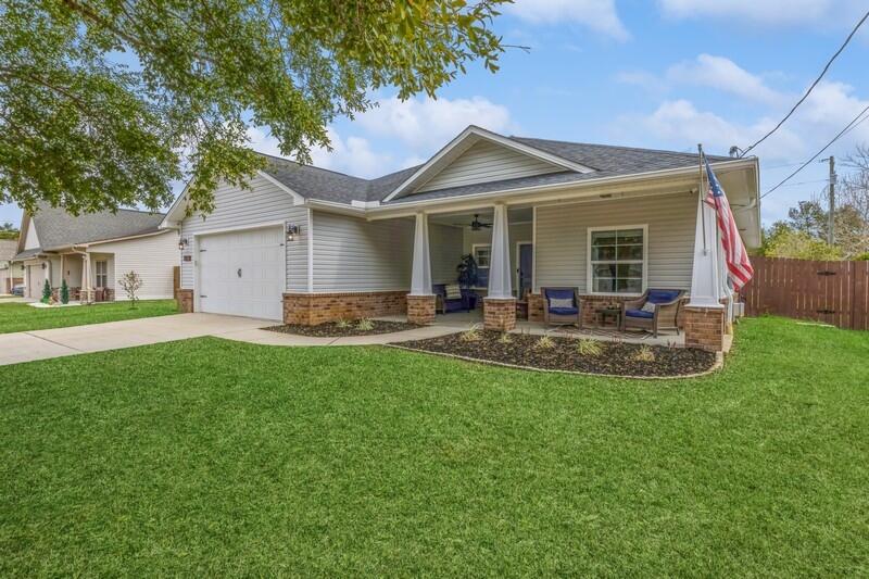 COMING SOON! Open House Weekend on March 8-10! Like New! This gorgeous 2015 craftsman-style home on a 1/4-acre lot features an open floorplan with 4 bedrooms, 2 full bathrooms and the perfect central living, dining and kitchen area connecting and making for great flow through the home. Entering the home from the welcoming covered front porch you walk into an inviting entry area that has the space for a small bench or piece of furniture. The living room has a high vaulted ceiling, and arched openings into the bedroom and kitchen/dining areas that complement the plan. The focal point of the dining and kitchen area is the large granite-topped island with breakfast bar and under storage.