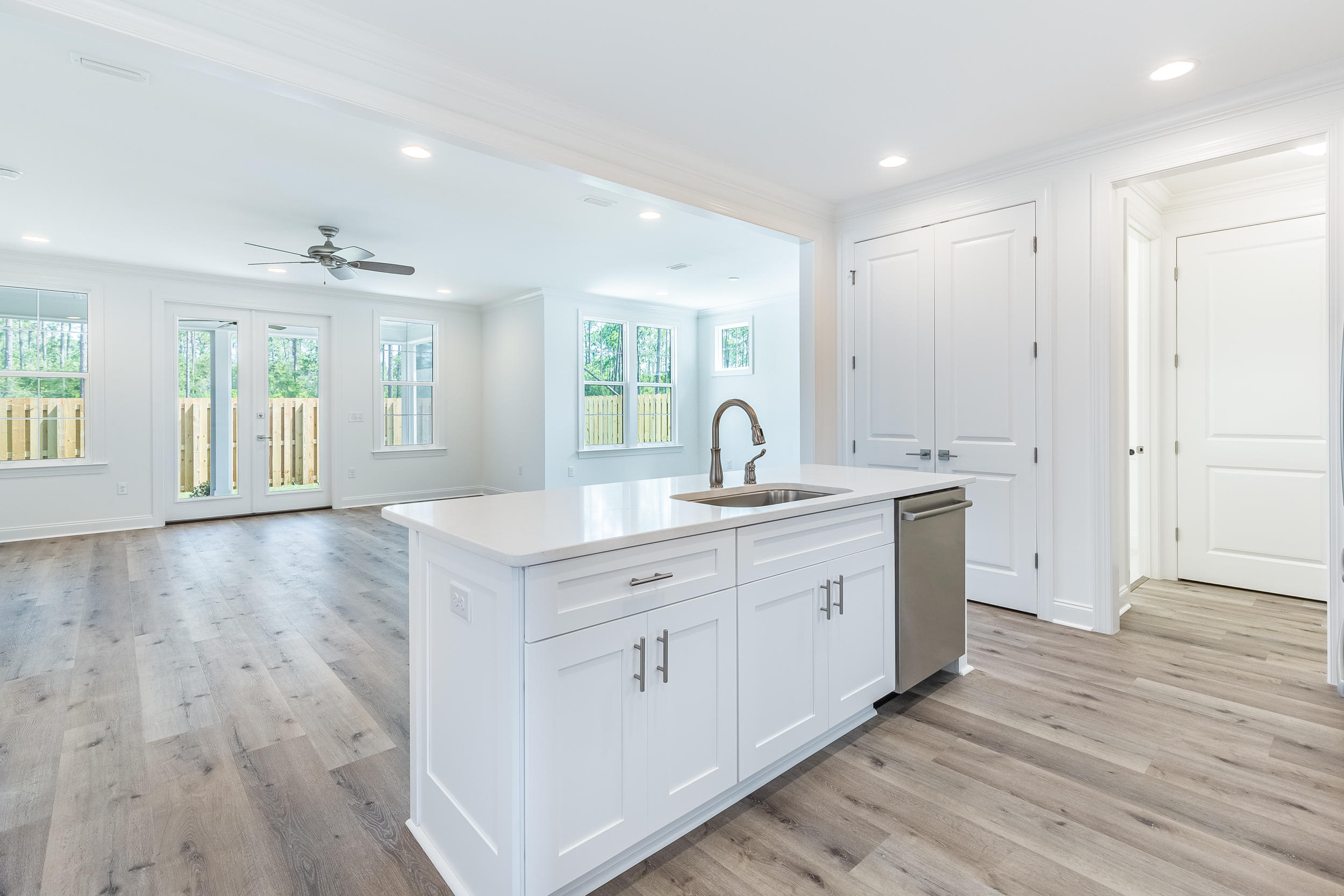 Introducing Stillwater, the newest neighborhood within the Watersound Origins community. The Bella B plan has 3 bedrooms and 2 baths with a 2 car garage and an extended front porch. This open floor plan includes 9' ceilings throughout, quartz kitchen and bathroom countertops, stainless steel Bosch gas appliances, wood cabinetry with soft-close features, tankless water heater, crown molding, and Luxury Vinyl Flooring throughout 1st floor. Notable exterior features include heirloom brick, irrigation system, gas stub for grill, and a large screened in back porch for entertaining.
