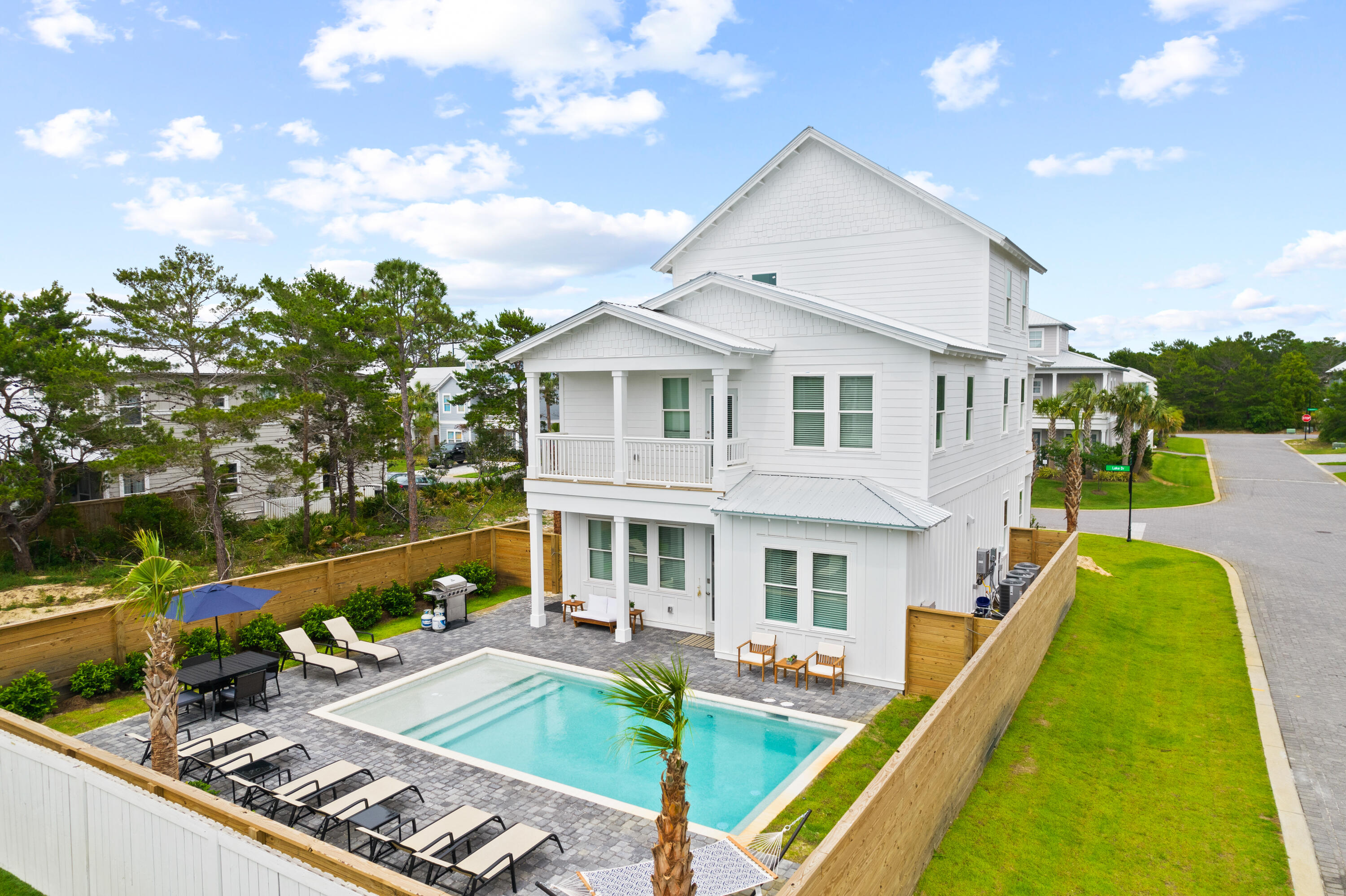 Newly completed in 2022, 7 Lake Street is adorned with high end and unique finishes that coalesce to create an ideal vacation rental property. Located in phase II of the gated community of Frangista Beach off of iconic Scenic Highway 98, the Sandy Pearl boasts private, deeded beach access for owners and visitors. This pristine 3-story home on a private corner lot is finished with modern coastal touches professionally curated and furnished by a local interior designer. The generous floor plan with stunning upgraded flooring throughout is open, light, and airy - making it both inviting and relaxing. Seven spacious bedrooms including two on the main level, and a third-floor kitchenette with an 8th king-sized bed allow this home to accommodate up to 24 sleepers in grand style. The kitchen
