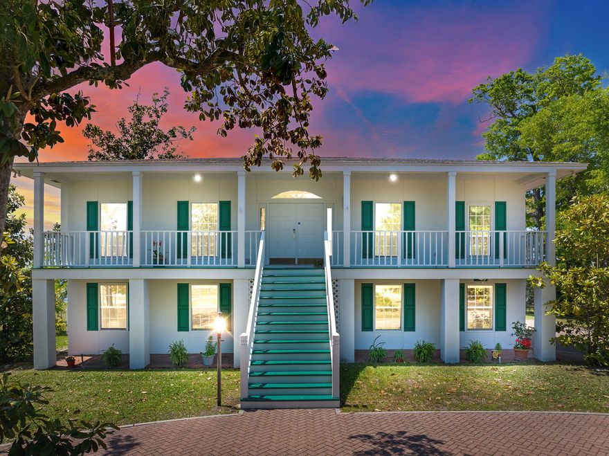 Welcome to 7552 Coleridge Road -- a refined Southern retreat on deep water, where classic design meets relaxed waterfront living. Nestled along the peaceful waters of Callaway Bayou and just minutes from Tyndall Air Force Base, this home offers both a serene setting and convenient access to everything the area has to offer. Set on beautifully landscaped grounds beneath a canopy of mature oaks, the property makes a striking first impression with its circular drive built with pavers and symmetrical facade -- the picture of timeless style. Inside, the main floor is designed for both elegance and ease. The spacious master suite features dual bathrooms and a generous walk-in closet. A quiet home office provides the ideal spot for work or reflection, while the formal dining room connects seamlessly to a bright kitchen and charming breakfast nook  perfect for morning coffee or casual meals with family and friends. The living room draws you in with warmth and character, centered around a fireplace adorned with a rare 1800s antique mantel  a unique statement piece that adds depth and charm to the home's heart. Downstairs, a kitchenette, additional living area, and three bedrooms create a flexible space ideal for guests, extended family, or multi-generational living. French doors lead to a large backyard overlooking the bayou  a peaceful spot to relax, entertain, or enjoy the water. Out back, a grand veranda framed by stately columns leads to an upper-level deck with panoramic views of the bayou  breathtaking at sunrise, magical at dusk. A private dock with boatable water depth welcomes boaters, while a built-in pump system supplies water to the lawn, making maintenance a breeze. With a roof replaced in 2019 and every detail carefully considered, 7552 Coleridge is more than just a residence  it's a Southern sanctuary, crafted for beauty, comfort, and effortless coastal living.