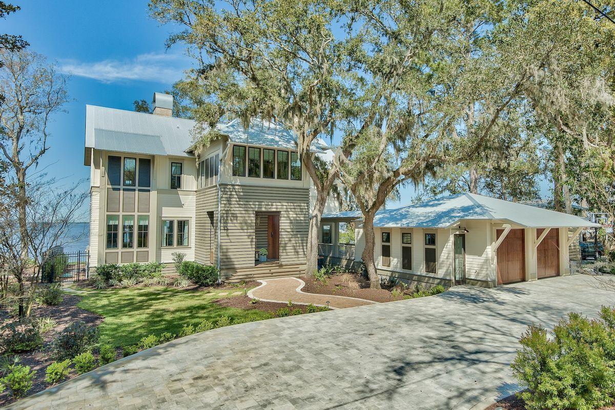 Presiding over 100 feet of bayfront in Point Washington, this recently completed 5 bed, 5 bath home perfectly complements its breathtaking setting. This is one of the largest waterfront properties, just 10 minutes from Seaside and WaterColor amenities. Architect Brian Stackable takes credit for the elegant Florida Cottage style while John Galvas Construction has brought every detail to life for his own personal home using top quality materials and craftsmanship. The result an enviable single-family home featuring wood flooring, oak beams, 14' Sea Pearl quartzite kitchen island and Turkish marble in the wet bar. Floor-to-ceiling windows and a full-width upper balcony provide a sense of living right on the water.