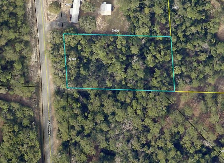 .90 ac parcel is with in minutes to I-10 . Paved road access, natural wooded , sloping lot .  Mobile Homes allowed. Please see the survey in the documents section.   Seller will consider offers.