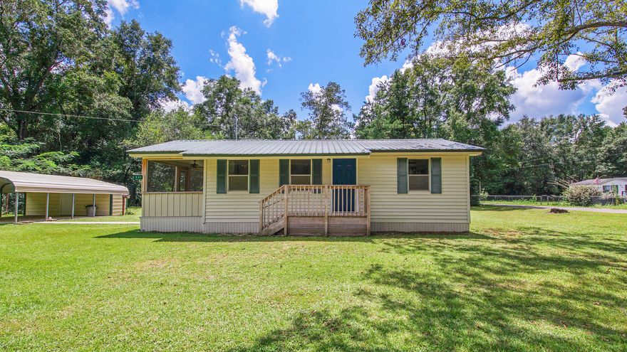 Completely and totally renovated original Jim Walter home (see his personal autograph on last pic). Home has been jacked & leveled, entirely new kitchen and bath, new lighting & fans, doors, sheetrock and tankless water heater. The best part is that the original heart pine floors were waiting to be revealed & revived - and they are beautiful! The kitchen has new, classic white shaker cabinets, new countertops and appliances. The bathroom is stylishly updated with new everything. There are 2 bedrooms and another that could be a 3rd bedroom. Pretty corner lot w/ room for more storage or play. Easy maintenance with vinyl siding & metal roof, carport and storage area. Screened porch on the east side to keep the mosquitoes at bay. Perfect for downsizing or a rental. Qualifies for all financing.