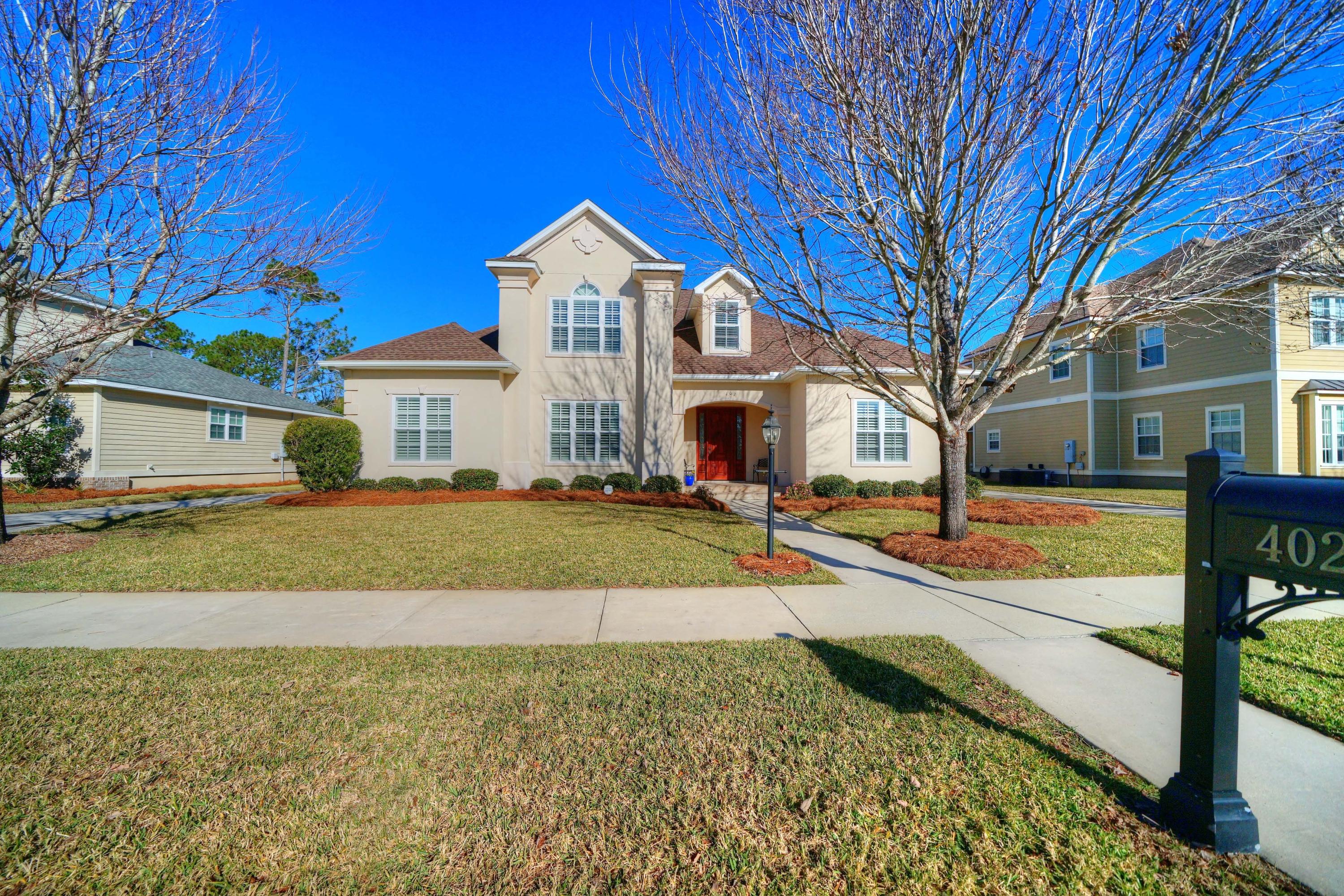 This stunning home offers five bedrooms plus an office at just under 2800 sq. ft. Interior features include raised ceilings, crown molding, columns, stunning tile and wood floors throughout with carpet in the bedrooms. The kitchen is gorgeous with designer cabinets, quartz counters, and stainless appliances. The open floor plan works perfectly for family gatherings and entertaining on those special evenings. The owners retreat is downstairs with his and her closets, amazing master bath with luxurious free-standing tub, and tiled shower. There are two additional bedrooms and the office downstairs. Upstairs features two more bedrooms. Additional features include premium Low E windows, New Roof December 2018, Travertine tiled covered patio with outdoor kitchen, and so much more!