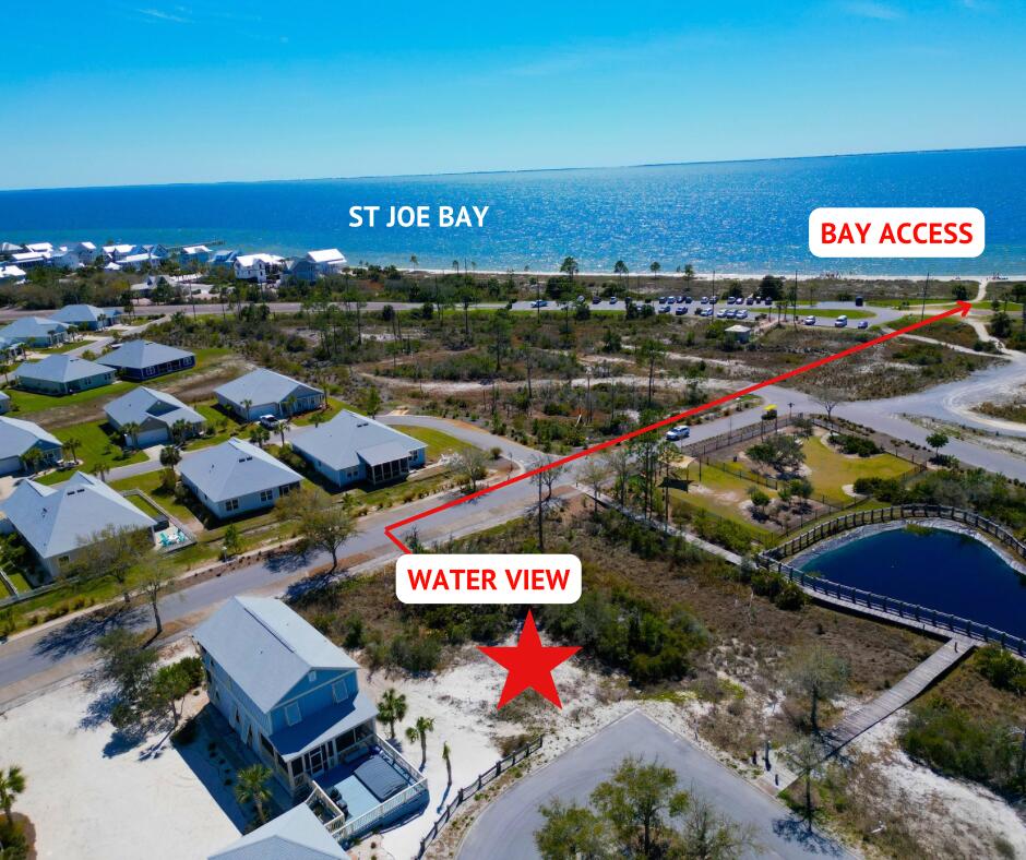 Nestled in the picturesque Fisherman's Village, North of Windmark Beach, Phase II, this beautiful building site offers easy access to the stunning beaches and pristine waters of St. Joseph Bay. With numerous options for enjoying the bay's views and breathtaking sunsets, you'll never run out of ways to relax and unwind. After building your dream home, take your golf cart to explore the vibrant town center, where you'll find a variety of dining options, shops, and a fitness center. Windmark's exceptional amenities include a beautiful community pool, scenic walking paths, and miles of biking trails. Plus, the lot is less than 100 feet from a well-maintained and enclosed HOA dog walk and run. The property is eligible for a finished home to be converted into a vacation rental. Less than 5 min. from St. Joseph Marina. Surveys and CCRs are available for your review.