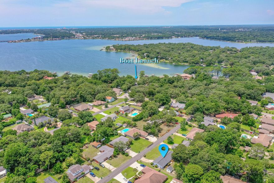 LIKE NEW HOME on huge .37 acre lot, a few blocks from boat launch & park & super close to base. NEW EVERYTHING INCLUDING, roof, insulation, electrical, plumbing, HVAC & ductwork, doors, baseboards, trim, flooring, 3 new bathrooms, custom light fixtures, scraped ceilings and interior & exterior paint in this gorgeous 2015 effective year built home. The stunning NEW KITCHEN takes center stage w/large island, high end Calacutta Lincoln Quartz counters,SS appliances, floating shelves & custom backsplash & flows effortlessly into the huge Great rm & Dining area.  Offering a split floor plan w/ TWO master BRs each w/their own new gorgeous bathroom plus 2 add'l BRS w/a 3rd new bathroom, there's room for everyone.  The giant backyard, with patio & storage shed, provides plenty of room for play & a pool and side access for boat/or RV storage.  Other features include tankless hot water heater, custom sliding door into 3rd bathroom and laundry area. Since practically EVERYTHING in home is NEW, forget about older home headaches/issues and spend your time enjoying the Florida lifestyle as the boat launch & park are just minutes away.  Located in the heart of Poquito Bayou, schools, shopping and restaurants are close by.