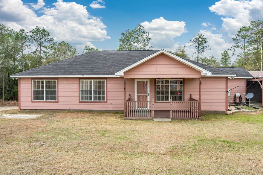 Enjoy Country Living with this 3 bd/2 ba home situated on 2.38 acres in the Holt community. A quick commute to several destination areas via the interstate which is within minutes of the property. The home has a cozy front porch and 2 car carport. Inside you will find tongue & groove white cedar walls in the spacious living room and hallway. Nice functional kitchen with adjoining dining area and a large laundry room spacious enough to accomodate a freezer or to provide additional storage space. Three nice sized bedrooms with master suite featuring a dual vanities, ''safe step'' walk-in tub and separate shower. Enjoy your morning coffee from your screened-in back porch. NEW HVAC in 2023. Private well (brand new pump w/in the last year), yard building and storage shed. Make your appt today!
