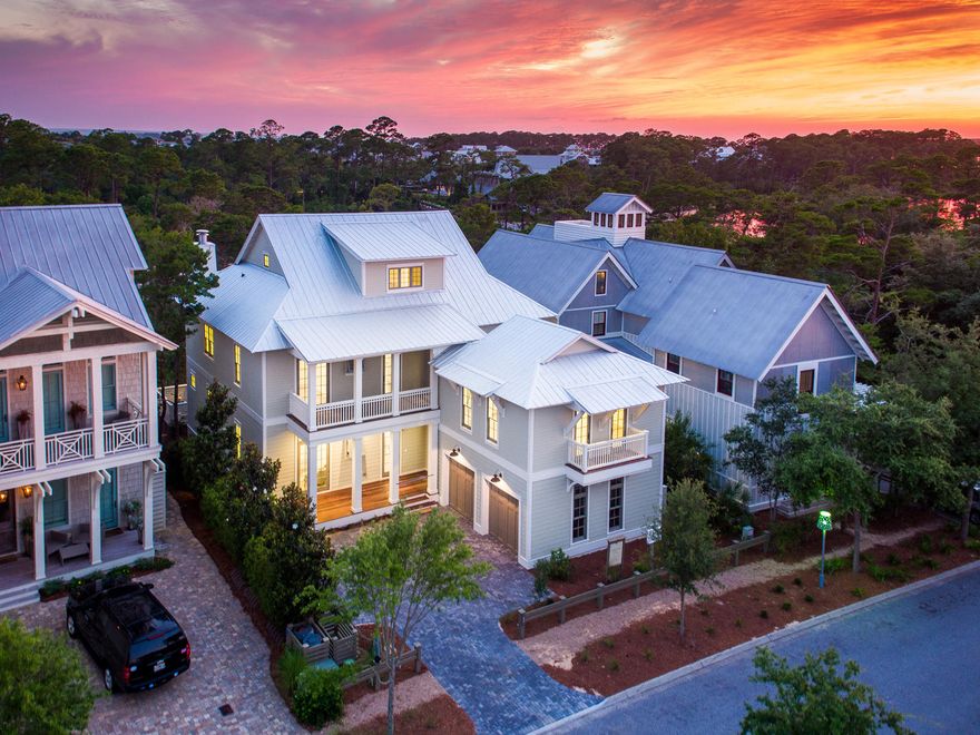 On this premium lakefront location sits this newly and exquisitely constructed large family home. Spend the day enjoying the beauty of the lake from the oversized screened living area complete with a built in summer kitchen, wood burning fireplace adjacent to its refreshing pool. The home offers a warm interior palette and luxurious finishes and features, including multiple living areas providing ample space to host large gatherings,all while captivating stunning views throughout. No detail has been spared reflecting only the finest quality of construction that includes Rock Wool, sound absorption insulation and 2nd & 3rd floor cork sub flooring and elevator. The carriage house is accessed through the home and has a separate living area. The 3rd floor offers a spacious bunk and entertaining area for children.  With 2 master suites this is the perfect home for 2 families. Located at the primary pedestrian bridge you an be at the beach club or the boathouse for lake activities or into Seaside for shopping and entertainment in minutes.  


