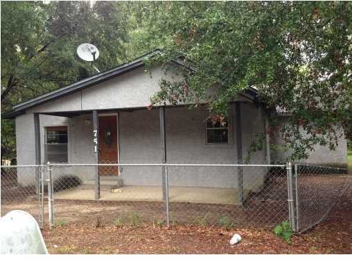 This home with some TLC has some nice features. Kitchen has been upgraded with newer cabinet and hardwood floors. Beautiful, mature trees and a fenced yard make this a deal at its current price. Buyer to verify for themselves any info deemed important.