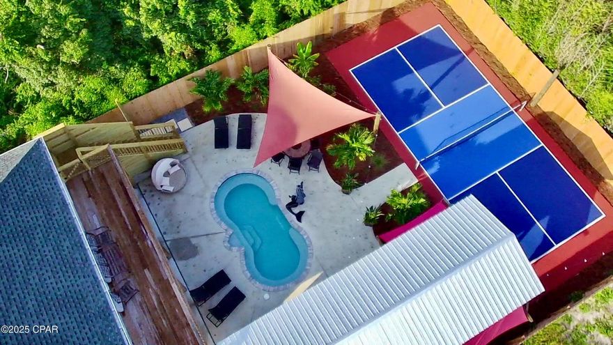 This private oasis is as versatile and unique as it is beautiful and well-designed! Every detail has been thoughtfully curated with extra amenities and features you won't find in most homes in Bay County, making this property an excellent choice for year-round living, an investment opportunity, or BOTH! Picture the possibilities of this exclusive retreat: Two, top-over-bottom 3 BR/2 Bath units, that can be opened up to create one space, a completely private backyard oasis with inground pool, outdoor kitchen and pickleball court, AND an additional pool house that creates another private living and sleeping space with a full bath and an outdoor half bath. All of this comes fully furnished indoors and out. This beautiful retreat sits at the end of the street, creating a private environment
