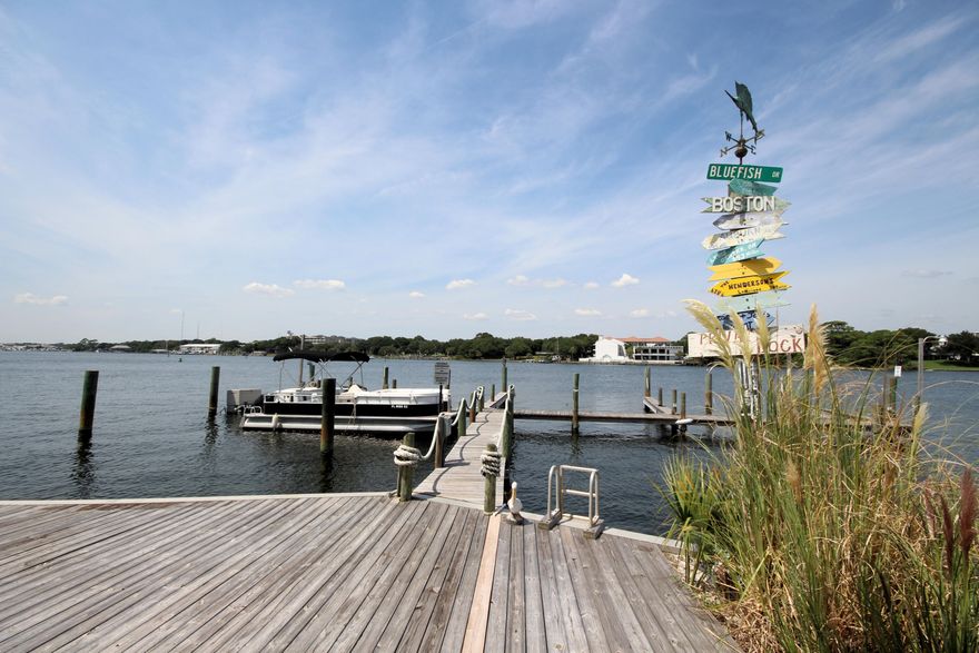 INCREDIBLE WATERFRONT VIEWS from EVERY room in this Okaloosa Island beauty!! This unit has been completely remodeled PLUS your condo has it's own private beach, dock AND assigned deep water BOAT SLIP!! This unit is truly move in ready. Once you step inside you'll notice the mahogony wood floors and fantastic kitchen. Custom cabinetry with soft close doors and drawers compliment the granite counters, tile backsplash, and upgraded stainless steel appliances. Don't miss the crown molding, newer windows, and new lighting throughout. The bathroom has travertine tile floors and shower walls and new vanity w granite top. Both bedrooms have 2 windows with panoramic views of the Intracoastal Waterway. Watch fireworks, boaters or sunsets from your balcony, dock or beach. Don't miss this one!