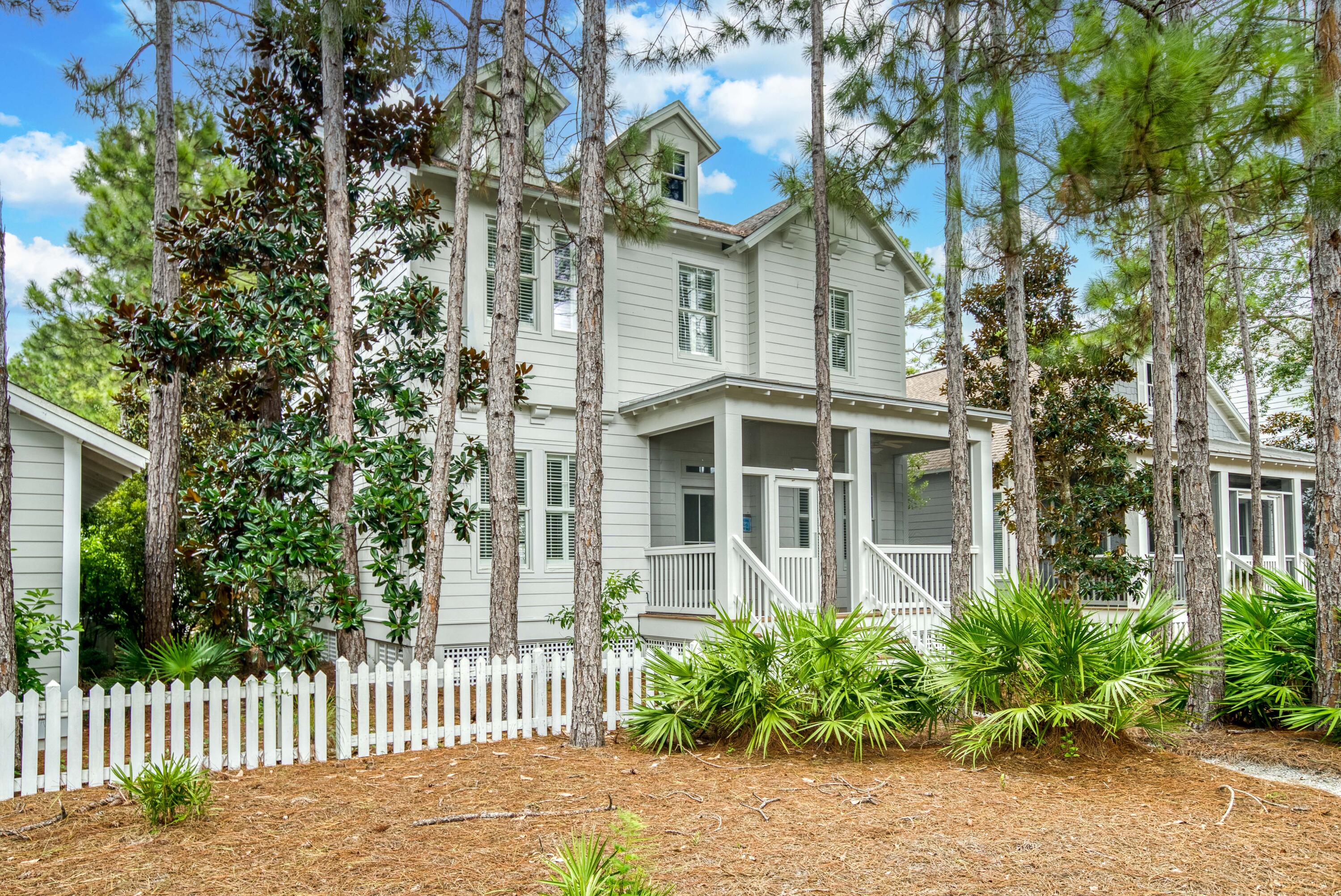 A charmed life awaits at this spacious 4BR/3BA Florida cottage in the coveted Watersound Origins community with an outstanding location overlooking the Village Commons with playground, swimming pool, fitness center and more. A cozy screened porch welcomes you into the open concept living and dining spaces highlighted by soaring ceilings, ample natural light and hardwood floors. The kitchen offers a large center island, granite countertops, stainless steel appliances and wood cabinetry. The first level includes a guest bedroom and a separate office/study. On the second level, find the large master suite with ensuite featuring dual vanity, large soaking tub and separate shower. Two additional guest rooms with a shared bathroom are also located on this level. A second screened porch on the