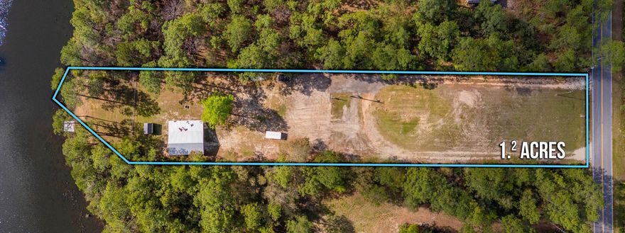 Don't miss this rare opportunity to own a breathtaking 1.2-acre waterfront property offering the perfect blend of privacy, convenience, and natural beauty. Nestled along 124 feet of direct lake access, this picturesque lot is partially fenced and already prepped for your dream home or weekend retreat.A spacious 36x36 pole barn is already in place, perfect for storage, a workshop, or future conversion. The property also features a storage shed, septic system, public water, and power--saving you time and hassle. Accessible via paved, county-maintained road, the location offers both seclusion and convenience.Mostly flat land with a gentle slope terrain down to the lake, beautiful views, and direct water access. This land is ideal for fishing, kayaking, or simply relaxing by the shore. Whether you're looking to build your forever home or find a vacation getaway, this property is ready to make your vision a reality. Only a very small portion at the waters edge is within a flood zone, so flood insurance is not required. 
Only approximately 8 miles to the city limits of DeFuniak Springs with other shopping options closer nearby.