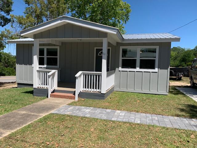 Neat as a pin and completely renovated one year ago. Could be used for residential or commercial according to zoning. Home has metal roof and hardy board siding. VP flooring inside, new kitchen appliances, HWH, HVAC, blinds, light fixtures, and plumbing. Large closets in both bedrooms, recessed lighting throughout. Large front and back porch. Lot fronts Hwy 90 and 4th street. City water and sewer. Enough space in back yard for extra parking or storage building. Conveniently located in downtown Defuniak.