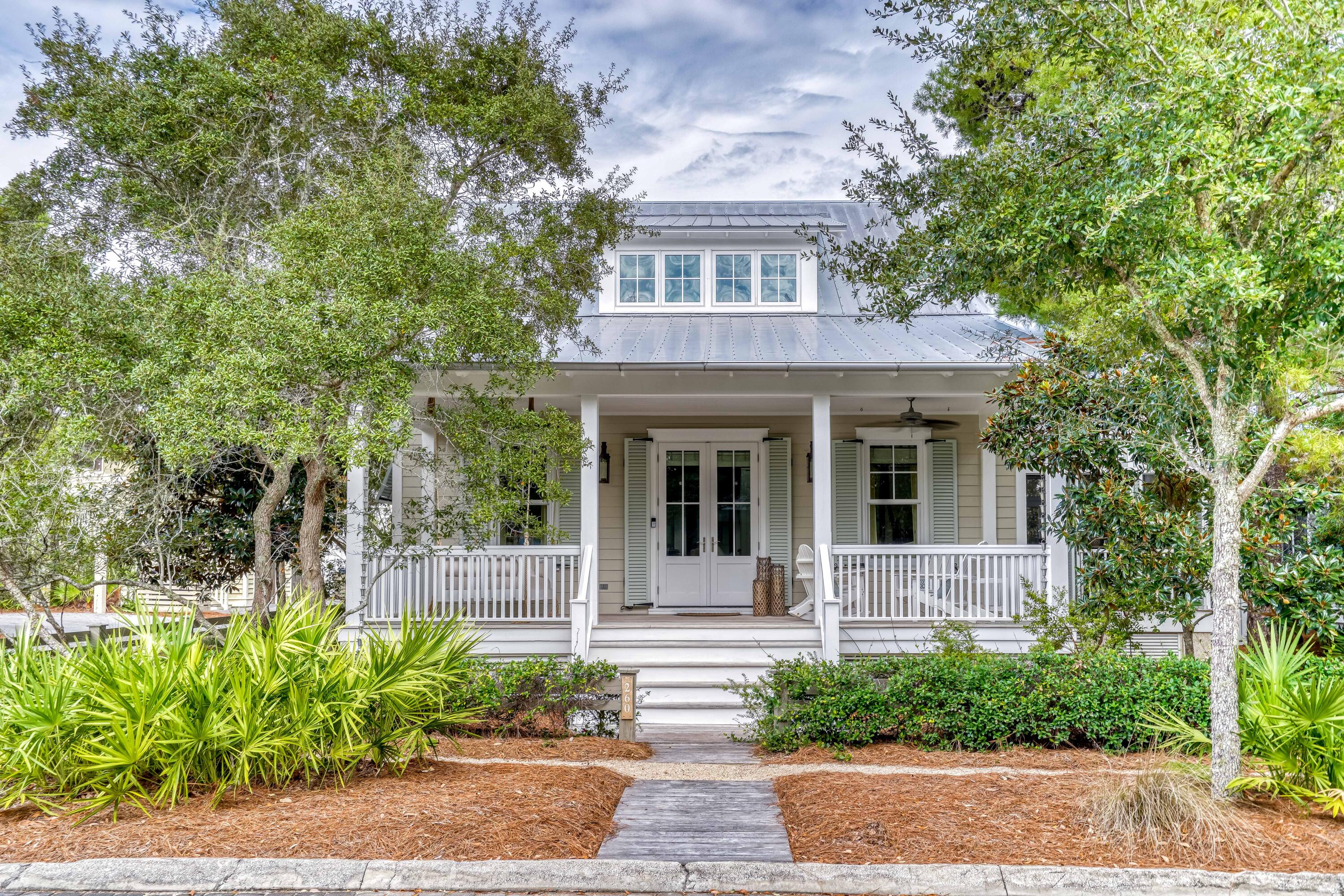 THE ONLY 5 BEDROOM HOME AVAILABLE IN WATERCOLOR! From the moment you walk in the door this TS Adams designed beach house offers the feeling that you have truly arrived at the beach. This quintessential Florida cottage offers everything needed for a truly relaxing retreat, enjoys a cozy feel without sacrificing space and its tucked away on a quiet corner just steps from the Frog pool and walking trails around Western Lake. Upon entering the home, you are welcomed into a bright and airy main living space complete with raised ceilings, shiplap accented walls, and an open concept. It also features a beautiful, updated kitchen and dining space and it comes complete with furnishings, luxury finishings, hardwood flooring throughout, and more.