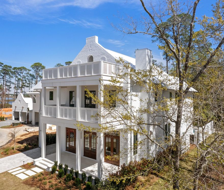 Welcome to the majestic oaks and gentle bay breezes of Churchill Oaks. This custom designed home was planned with today's modern lifestyle in mind, offering an abundance of natural light, a separate carriage house with bedroom, living space and kitchenette, two car garage and a porte-cochere. This stately residence will offer superb outdoor space with a private pool, porch and summer kitchen to make entertaining and enjoying the outdoors a year-round experience. Interior finish details include custom cabinets and tile, Miele appliances with dual-fuel stove, wide plank oak wood floors and coffered and vaulted ceilings.  A flexible third floor multi-purpose room with bay views can be used as an office, home gym or reading room.