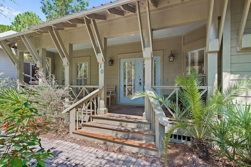 Backing up to a natural wooded area and just a quarter mile from gulf waters, this single level, tranquil beach cottage is enhanced by its high quality custom finishes. Polished hardwood flooring adds a beautiful touch to open living areas while granite countertops grace an elongated breakfast bar. Floor-to-ceiling windows bring the garden greenery inside while 250 square feet of covered porch spaces deliver shady areas for barbecues, relaxing, and entertaining. This home offers an outdoor Florida lifestyle with community pool nearby, boardwalk to the canal dock for launching kayaks, and a bike path to local shops and Seaside attractions.