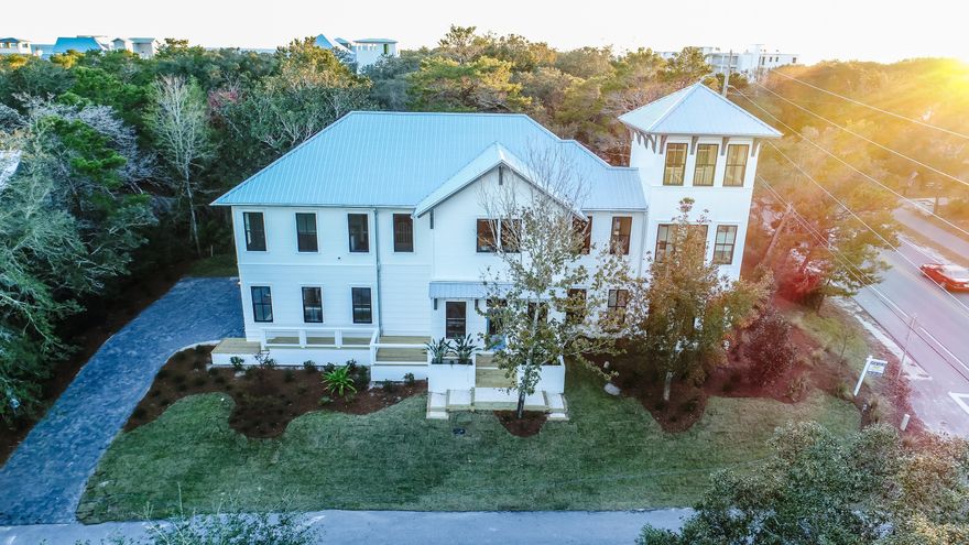 This elegant home is situated on one of the highest elevations in Seagrove. The 3 story tower adds majestic curb appeal in a coveted location. Fabulous rental potential only 2 blocks to the sugar sand beaches of 30A, with upscale dining and shopping. Home will be sold fully furnished and rental ready. This spacious home offers 5 bedrooms, plus bunk room, 2 large living rooms, gorgeous custom tile and cabinetry throughout. From the vaulted great room you look out on the sparkling waters of your own private pool with adjacent outdoor kitchen. Two master suites invite owners and guests to enjoy the luxury of this well appointed quality construction. A two car garage, golf cart parking, and generous enclosed outdoor storage maximize the convenience. No detail has been spared, including laundry
