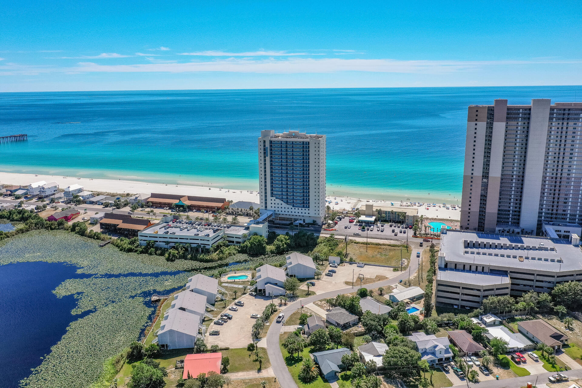 Centrally located and with the best of both worlds, this property will be fantastic as a homeaway from home- or a passive income generator!Welcome to 301 Lullwater Drive #413! This 2-bedroom 2 bath lake front condo is just a block away from the pristine beaches of the Gulf of Mexico and convenient to Pier Park withshopping, dining, entertainment, and nightlife.Fully furnished with modern furniture and coastal decor, this beautiful condo has plenty ofroom to sleep up to six people. Relax with low maintenance LVP floors for easy cleanup after aday at the beach and enjoy updates such as new stainless-steel appliances, modern fixtures,and a breakfast bar. You or your guests can also sit in the spacious living room or on the deckand enjoy the views of Lullwater Lake.