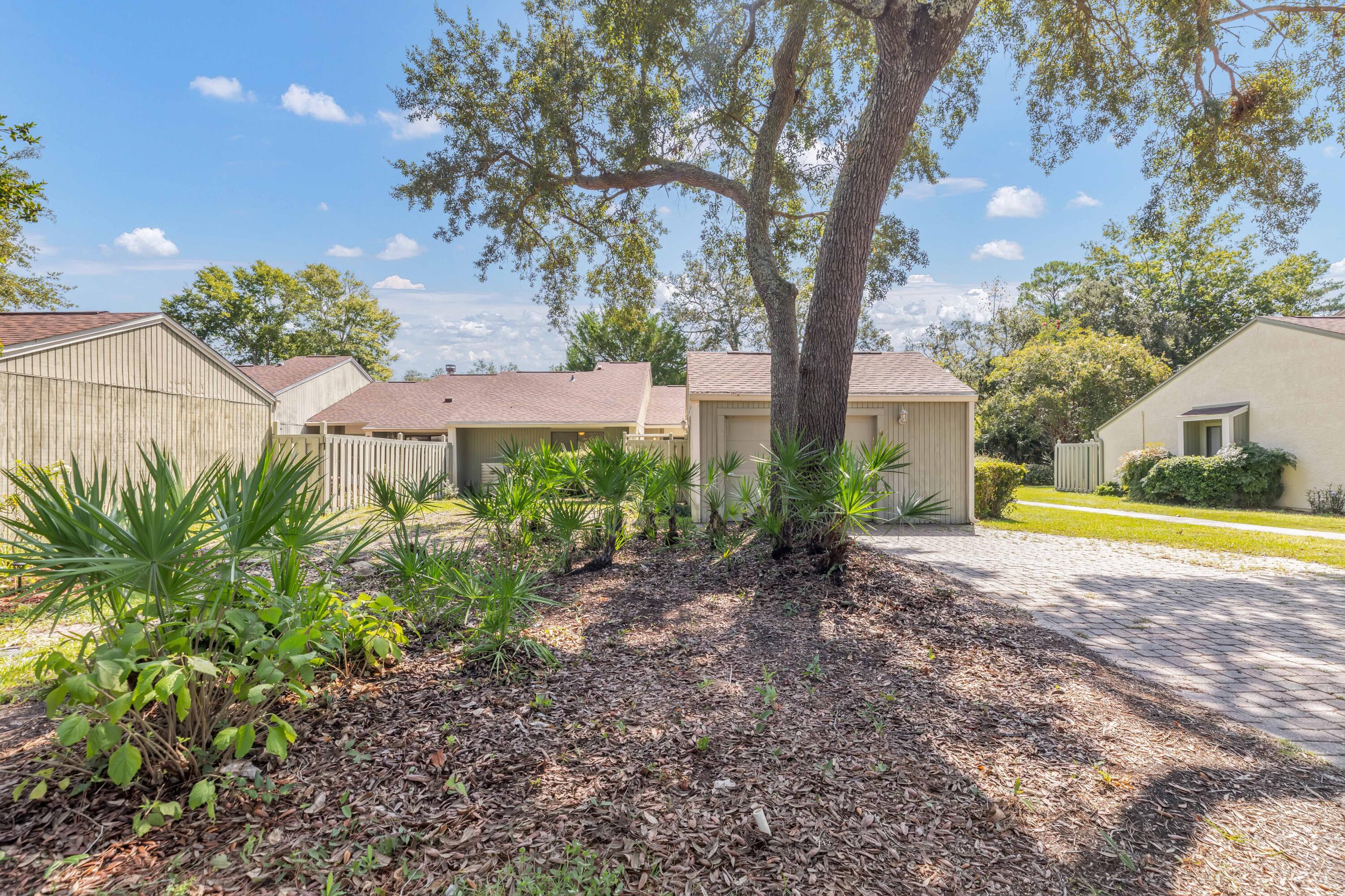 Nicely  updated townhome!! As you pull onto your cobblestone driveway, there is a one car garage that is extra wide for storage. You will walk through your  own private patio area that is great for flowers, relaxing and morning coffee.. Upon entering, newer Bamboo wood flooring and tile laid in both baths. The  kitchen has all newer cabinets,  stainless Frigidaire dishwasher, range and microwave. Newer sink and granite counter tops finish off this spacious room. Updated  ceiling fans and fixtures! NO more popcorn ceilings! Vaulted ceiling and fan in living room, give a wonderful open feel. Dining area opens up to a fully finished FL.  room that is heated and cooled. Updated vanities and commodes in both baths. Both bedrooms have walk in closets. HVAC and water heater is 7 yrs old.