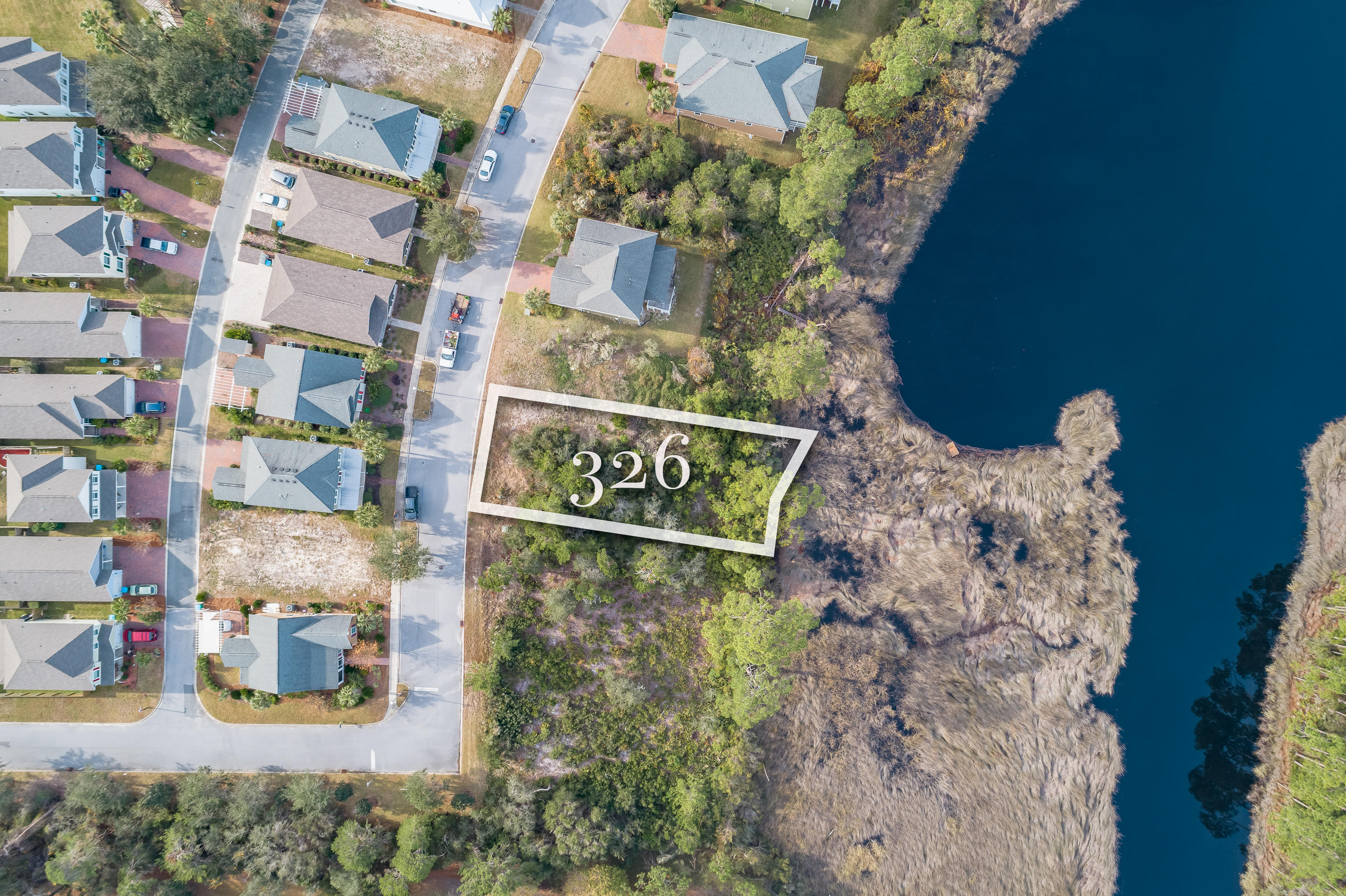 Lot Size is 52 X 163. This is a waterfront on Lake Powell with a great view. Lake Powell is a coastal dune and a treasure in the bay county area. Turtle Cove is a great community with fitness center, clubhouse, and pool. There is also a community dock available for owners to use. The community is near shopping, restaurants, Pier Park, and PCB airport. Buyer to verify dimensions.