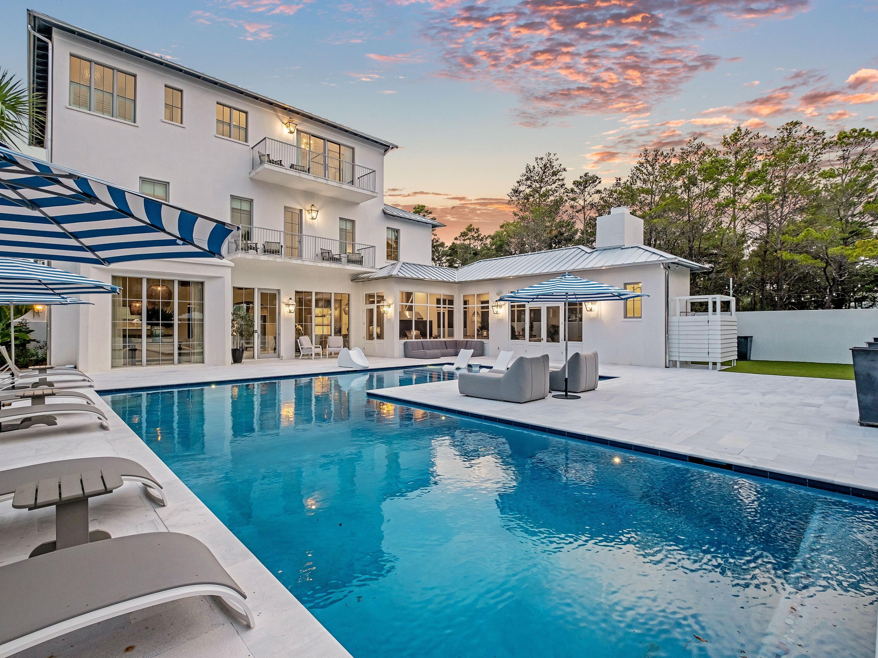 Welcome to unparalleled coastal luxury at this exquisite new construction home in the heart of Inlet Beach, located just steps from Rosemary Beach's eastern boundary. Designed by Darrell Russell of A Boheme Design and meticulously crafted by Jared Smartt of Earthbuild LLC, this architectural masterpiece redefines coastal elegance.Spanning 5,664 square feet across three levels and situated on an expansive .63-acre gated and walled homesite, this solid concrete construction estate offers the ultimate in privacy and refinement. The heated and cooled oversized two-car garage, coupled with lush custom landscaping nourished by a private well, sets the tone for the grandeur within. Step inside to discover a symphony of fine finishes, including Diana Royale marble flooring on main living and Borghini marble countertops and backsplash in the chef's kitchen. Outfitted with top-of-the-line appliancessuch as a 48-in. Wolf dual-fuel range, Sub-Zero refrigeration columns and a Miele coffee machine  the kitchen is a culinary dream. Venetian plaster walls, a groin vault ceiling in the foyer, and beamed ceilings and a fireplace in the living area elevate the home's design.

This residence boasts thoughtful functionality with three laundry rooms, custom blinds and a master suite with gulf views, featuring a bespoke closet and Calacatta Gold marble bath. Outdoors, expansive living spaces feature a heated and cooled saltwater pool and spa, a fireplace and an outdoor movie area with garden lights. The garage is oversized with a 14.5' ceiling making it possible to install a car lift.

High speed internet cable is currently being installed on the street.

Built with solid concrete construction, a Galvalume standing seam roof and aluminum doors, windows and gutters, this home is as low-maintenance as it is luxurious. Thoughtful touches like Flo smart water monitoring, heat sensors, and lightning protection on roof ensure effortless living and positively impact insurance. Whether enjoyed as a second home or a primary residence, this Inlet Beach estate offers a rare opportunity to experience refined coastal living.


