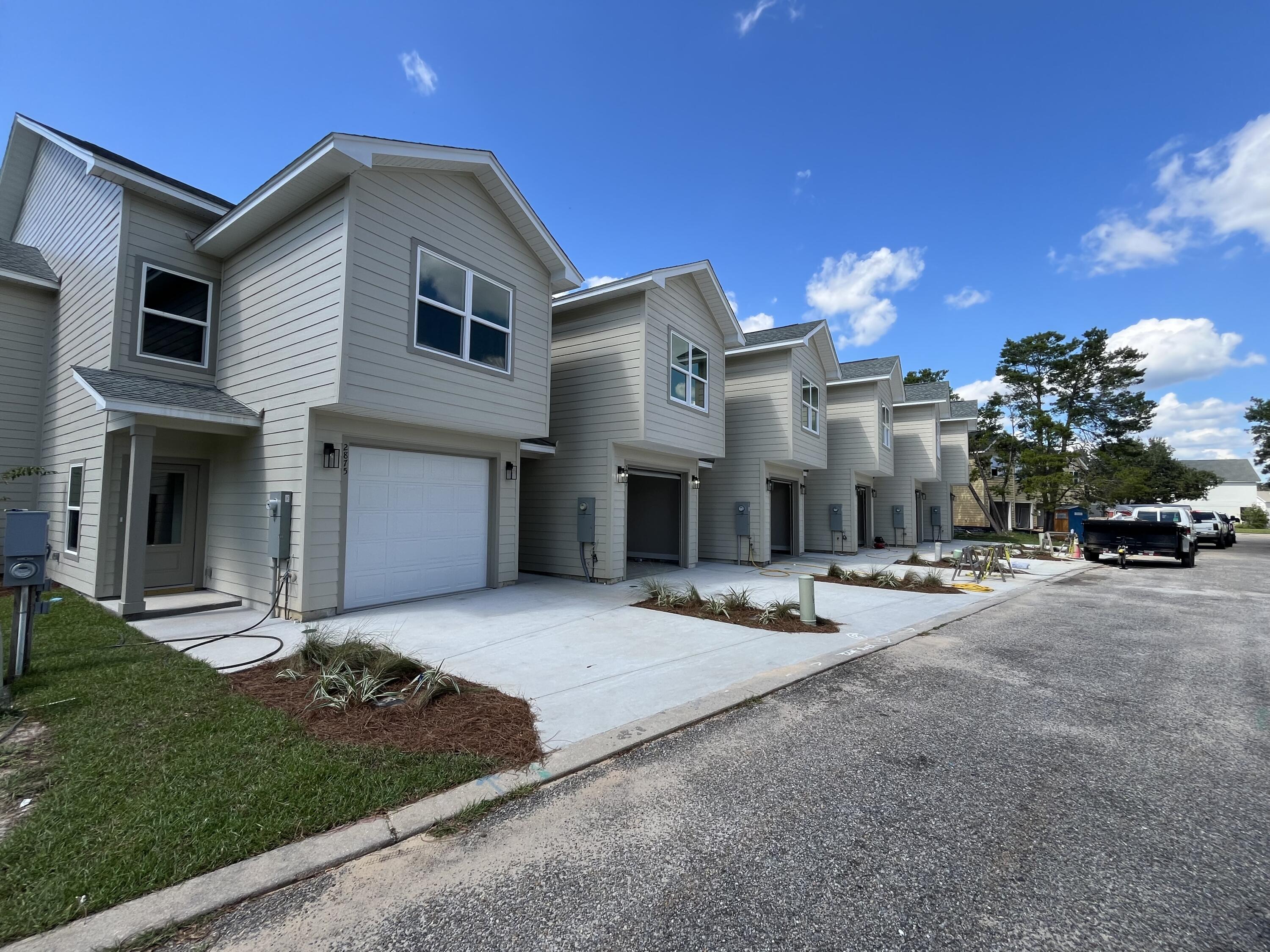**Move-in Special: 1st month rent free** Stunning new construction 5-bedroom, 3.5-bathroom townhome in Hidden Bay Village. This two-story home features an open-concept living area with high ceilings, large windows, and a door to the backyard with a full length glass panel, filling the space with natural light. The kitchen boasts upgraded appliances, granite countertops, and more.There are two primary suites: one on the first floor with an ensuite bathroom, perfect for convenience and accessibility, and another luxurious primary suite on the second floor with a walk-in closet, dual vanities, a soaking tub, and a separate shower boasting two shower heads. Three additional bedrooms provide ample space for family or a home office.