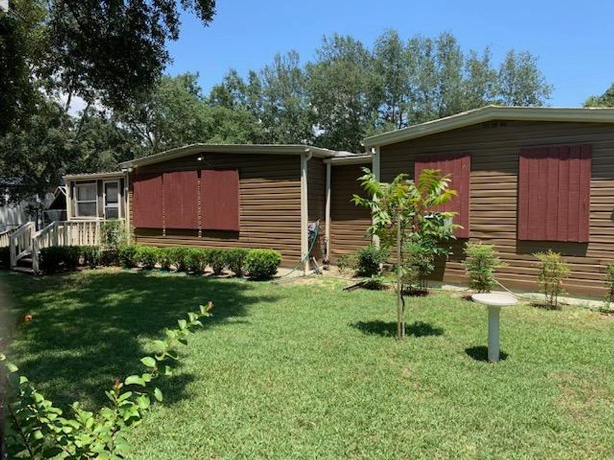 This is the cutest Florida cottage-type property! Well loved and clean as a whistle. Beautiful fenced in back yard. Nice screened in porch on back of home and cute little open porch on the front. RV parking available with RV outlet for electric power. Breakfast nook, formal living area and den area.