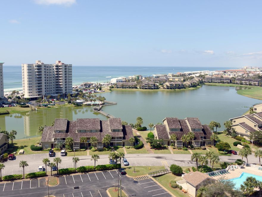 Spectacular Gulf and lake & skyline views from the huge covered balcony. Dressed to the 9's and offered fully furnished..This unit has never been rented. Totally renovated from the ceiling to the floorsWood and tile floors and simply classic! Lovely, quality furnishings included along with a stackable washer & dryer! Storage area just outside condo entrance.
All the amenities of SeascapeExercise facilities, Cabana's Restaurant, heated pools. Just 500 yards to the beach. You're challenged to find a nicer property at this price.Seascape quarterly is $487 or $162.83 per mo. And Ariel Dunes II dues are $346.80 per month. All dimentions to be verified by buyer.