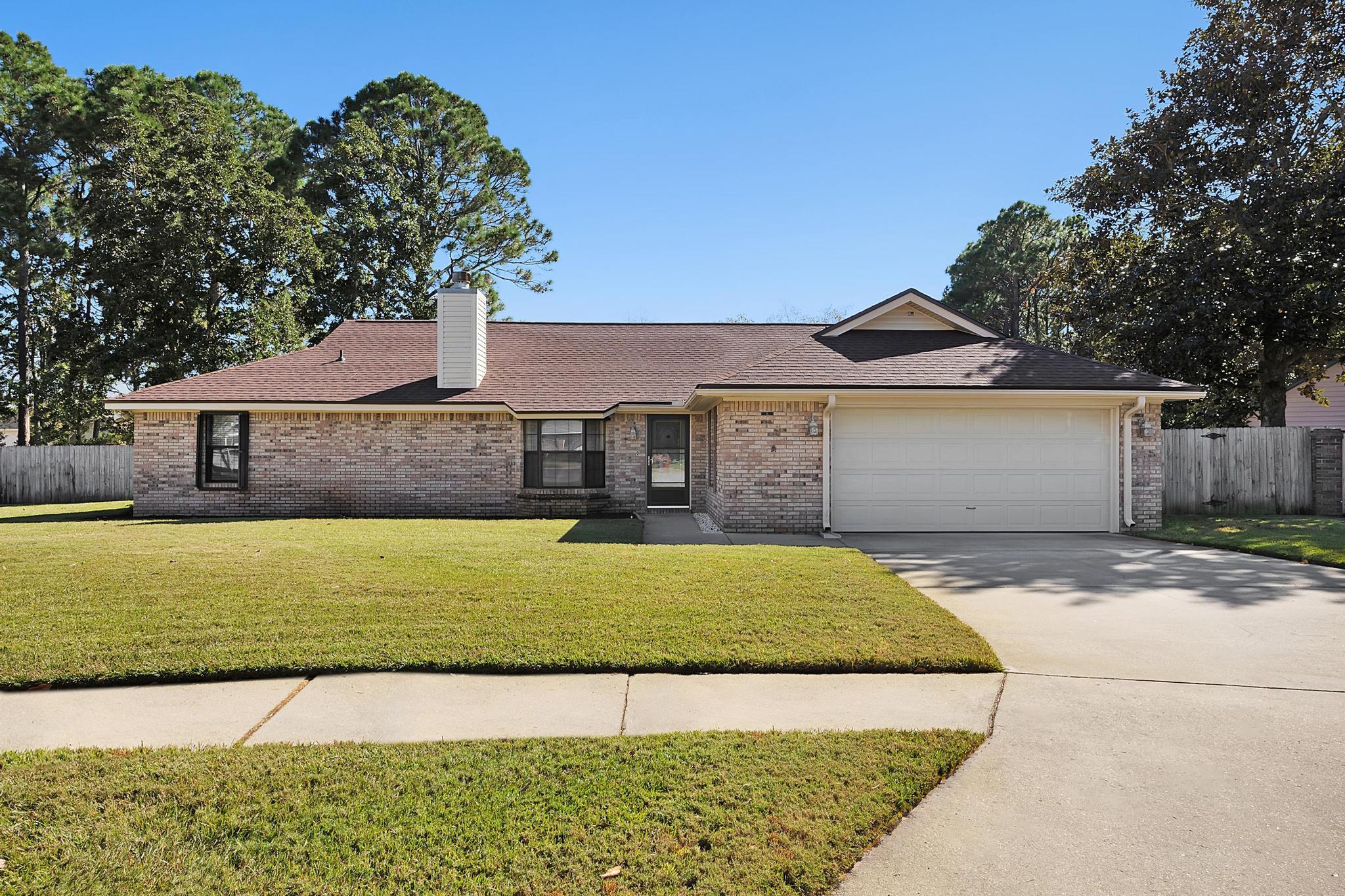This meticulously well kept home sits in a serene cul-de-sac neighborhood.  The manicured lawn boasts great curb appeal.  Upon entering the home, you are greeted by an oversized living/dining area complete with a vaulted ceiling, a beautiful bay window and a wood burning fireplace.  The kitchen is just off the dining area, and has vast amounts of counter space for entertaining, as well as an eat in bar.  The expansive master bedroom has an ensuite bathroom with walk in closet, but also has sliding doors that lead to the oversized Florida room.  The split bedroom floorplan is perfect for family or guests.  You will adore the wall to wall windows in the Florida room, which can easily slide open, bringing in refreshing fall air.  The large lot has a privacy fenced backyard.  It's a must see.