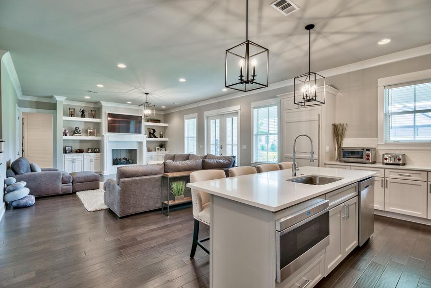 This newly constructed home boasts a warm and inviting feel that many are looking for in the highly sought after Kelly Plantation Community. This 4 bedroom, plus office home has all the space you need with 3 living areas, ample finished attic storage and upgrades galore! This home was purchased unfinished & has since been finished with all new Wolf appliances and custom cabinets on brand-new Subzero dual refrigerator and freezer columns. Leviton Decora smart switches automate the lighting with remote dimmers. Ecobee 4 zoning system upstairs and Honeywell smart WiFi thermostat on main level. Custom wood closets, custom window treatments, new bathroom hardware, home security system with Nest doorbell cam and a beautiful outdoor summer kitchen are just a few of the recent upgrades.