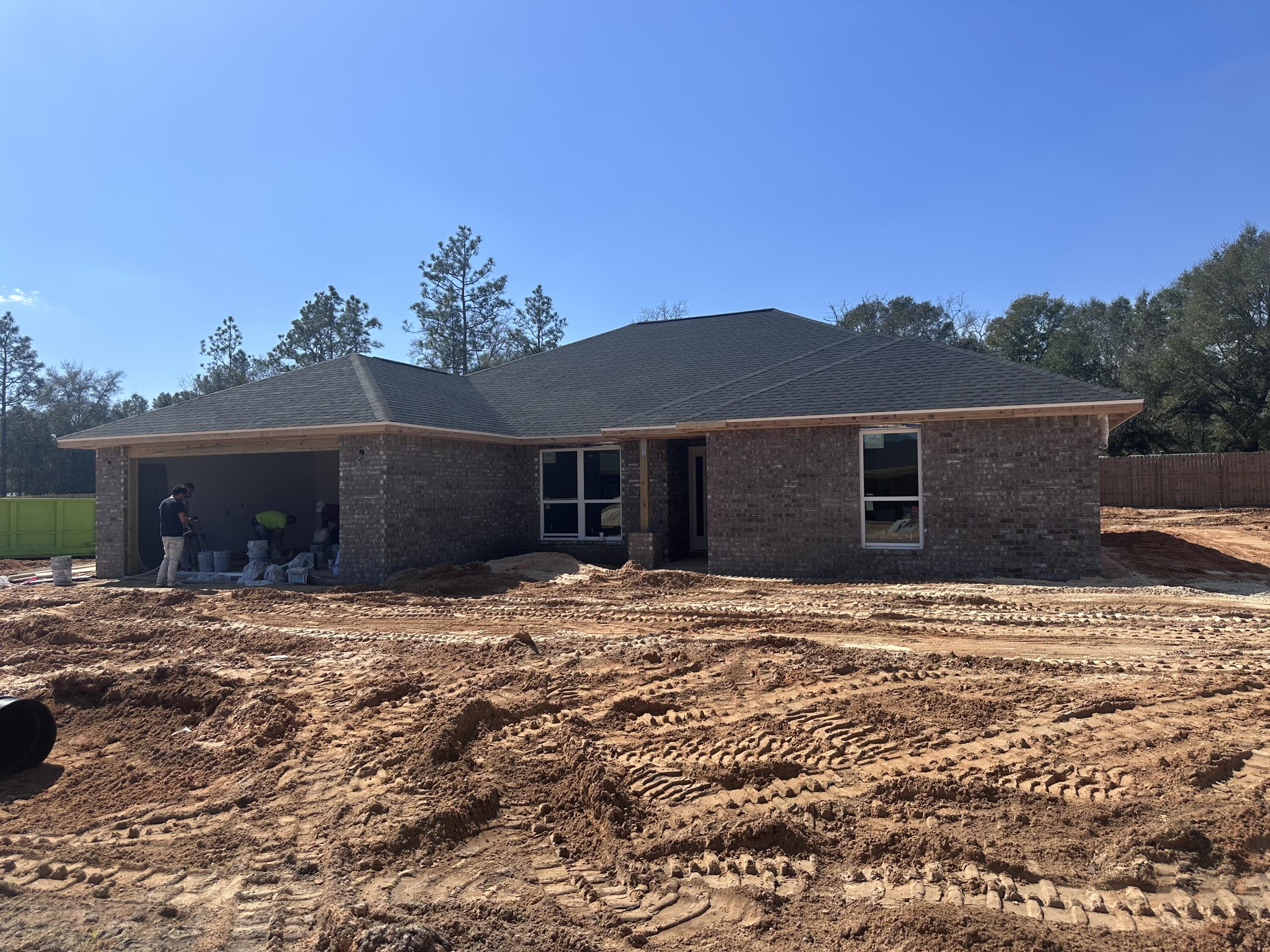 This home has 4 bedrooms and 3 full bathrooms and is a split bedroom plan as well. It features an open concept with the kitchen overlooking the family room with it's cathedral ceiling. The kitchen has a large island and adjoining breakfast area. There is an abundance of recessed lighting as well as natural light from all the windows. The patio can be accessed from the family room. The master bedroom is large and adjoins the master bath with it's double vanities, walk in closet, garden tub and separate shower. All wet areas as well as the family room and foyer have a durable LVP flooring with carpet everywhere else. The lot is fully sodded and landscaped and this home comes with a10 yr Bonded Builders Warranty on the structure.