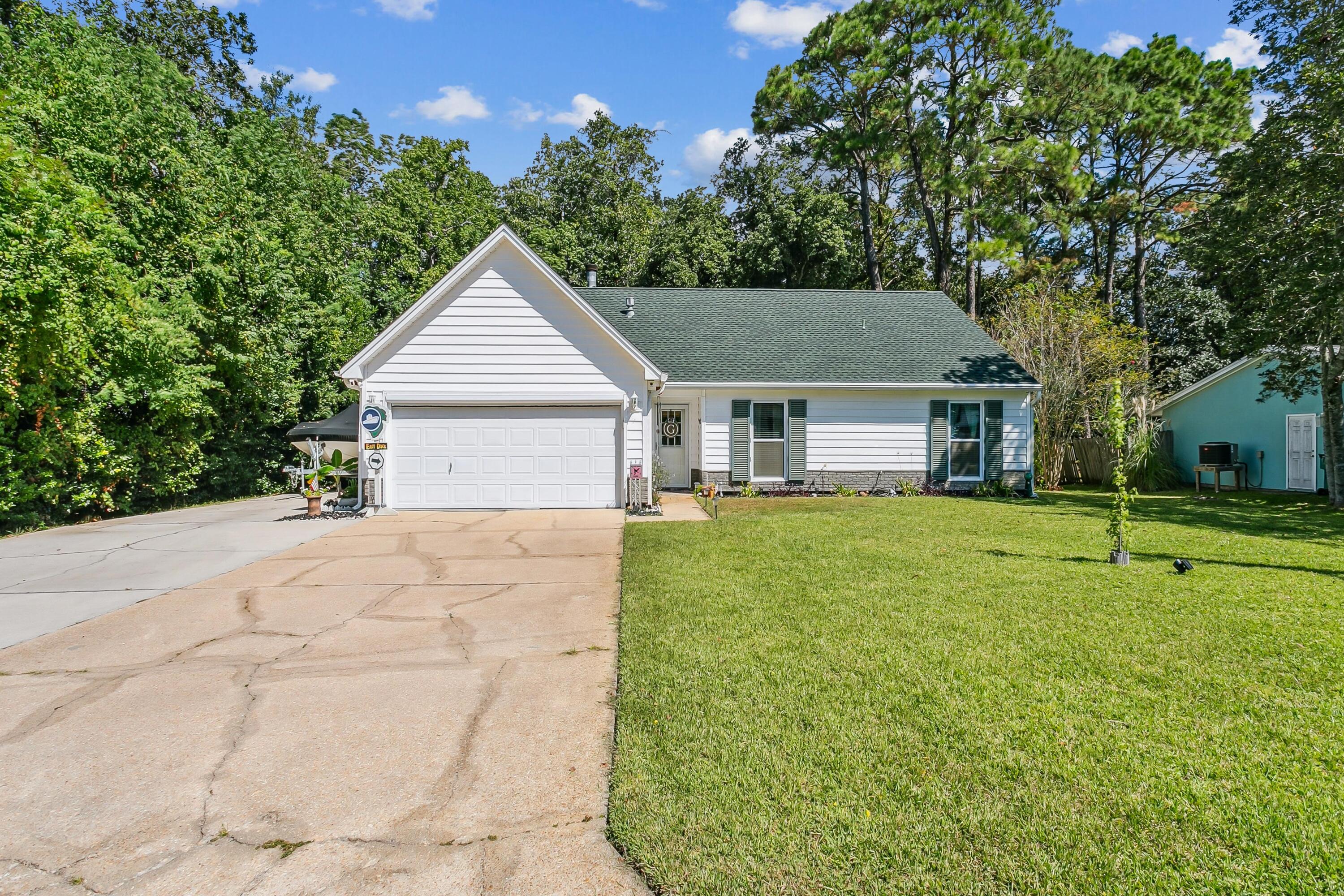 Nestled in one of the most sought-after neighborhoods in Fort Walton Beach, this spacious 4-bedroom, 2-bath home offers 1,538 square feet of comfort & charm. Find a warm and inviting open-concept kitchen that flows seamlessly into the living room, the perfect setup for entertaining family and friends. Property encompasses a screened-in garage, ideal for extra lounging or storage. The backyard borders a beautiful nature reservation, offering tranquil sounds of nature and a peaceful flowing creek. Enjoy & relax in your private hot tub, a bbq pavilion easy for cookouts and entertain guests on its expansive decking. This property delivers with ample parking, including room for a RV, trailer, or boat! Don't miss your chance to own this one-of a kind property!