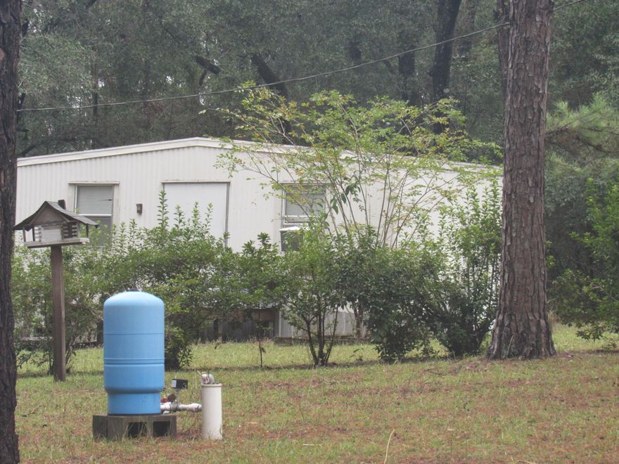 Back on Market at no fault of seller! Great lot in the Valley! This lot has all utilities and a 12x24 Storage shed that has insulated walls, electric and plumbing installed. This lot has a well (needs a pump), septic tank and a power pole. Power is currently hooked to the storage shed/camp shed. Beautiful trees adorn this site and there is some landscaping and grass. Survey available. Don't miss out on this one, it won't last long! Great spot for a manufactured home! Unrestricted! Call for your tour today!