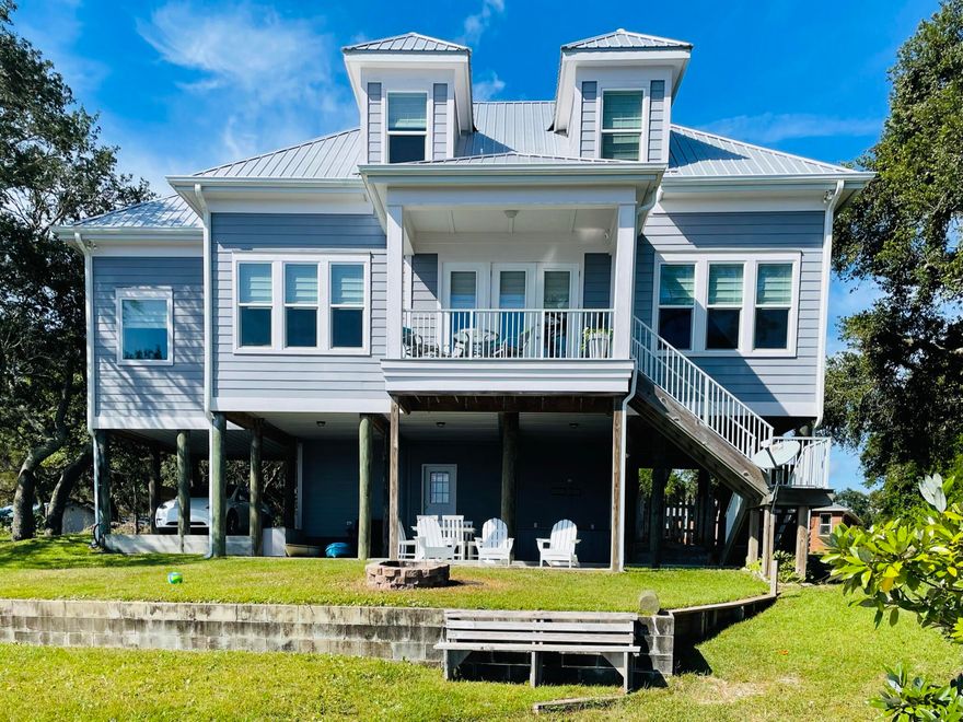 Welcome to 2975 Holley Point Rd in Navarre, FL, where coastal charm meets modern convenience. This lovely waterfront home spans 2,242 sf and offers quality craftsmanship combined with style and comfort. With 3 spacious bedrooms and 2.5 bathrooms, this residence is designed to meet the needs of today's discerning homeowner or investor.The raised design of the home provides an inviting entrance into a beautifully laid-out interior with sweeping bay views.  The open floor plan seamlessly connects the living spaces, creating an ideal environment for both relaxation and entertaining. High ceilings and large windows allow stunning water views and  natural light to fill the rooms, while highlighting the home's  thoughtful finishes and details. The expansive living area flows into a well-appointed kitchen complete with ample counter space and cabinetry, making it a dream for those who love to cook and entertain. The primary suite offers a private retreat with a view including an en-suite bathroom with tiled walk in shower and soaking tub, plus a large walk in closet, providing a serene space with a view to unwind at the end of the day.

Outside enjoy a delightful constant breeze, large oak trees and a gently sloping lawn leading to a private dock with an 8000 lb. boat lift right on East Bay! Watch dolphins and ospreys, launch kayaks and paddleboards or fish for dinner from the dock of your private oasis. This is the best of FL waterfront living!

The ground level offers covered parking, a large storage room and an additional finished bonus space with full bath, currently used as extra sleeping room. There is room for a future elevator.

Situated in the desirable Holley Point area, this property promises a lifestyle of tranquility and convenience with easy access to the interstate and just a short distance from the stunning beaches of Navarre. This home would make a perfect primary residence, second home or vacation rental - the possibilities are endless.
 