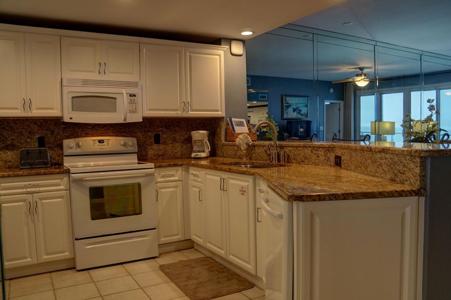 Sterling Sands 713 has everything that is hard to find in today's Condo market. Located on the 7th floor, the views are impeccable from the east to the west. The Seller spared no expense on upgrades. The kitchen has been remodeled to include granite and new cabinetry. Both baths have granite counter tops, and the guest bath has a custom, gorgeous walk in shower. The wet bar has granite as well! All interior flooring is tiled, plus, the balcony has new tile which adds a stylish finish to the overall look. The final coveted feature is a deeded, covered parking spot. Sterling Sands complex had a complete overhaul in 2012, the balconies were refurbished last year, and the elevators are currently being upgraded.