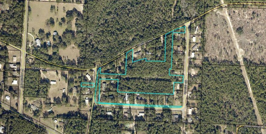 6.77 acres just off of Hwy 4 in Baker. Great for residential development. There are 4 access points to the property. - two off of Pickens Circle and two off of Garrett Mill Road.