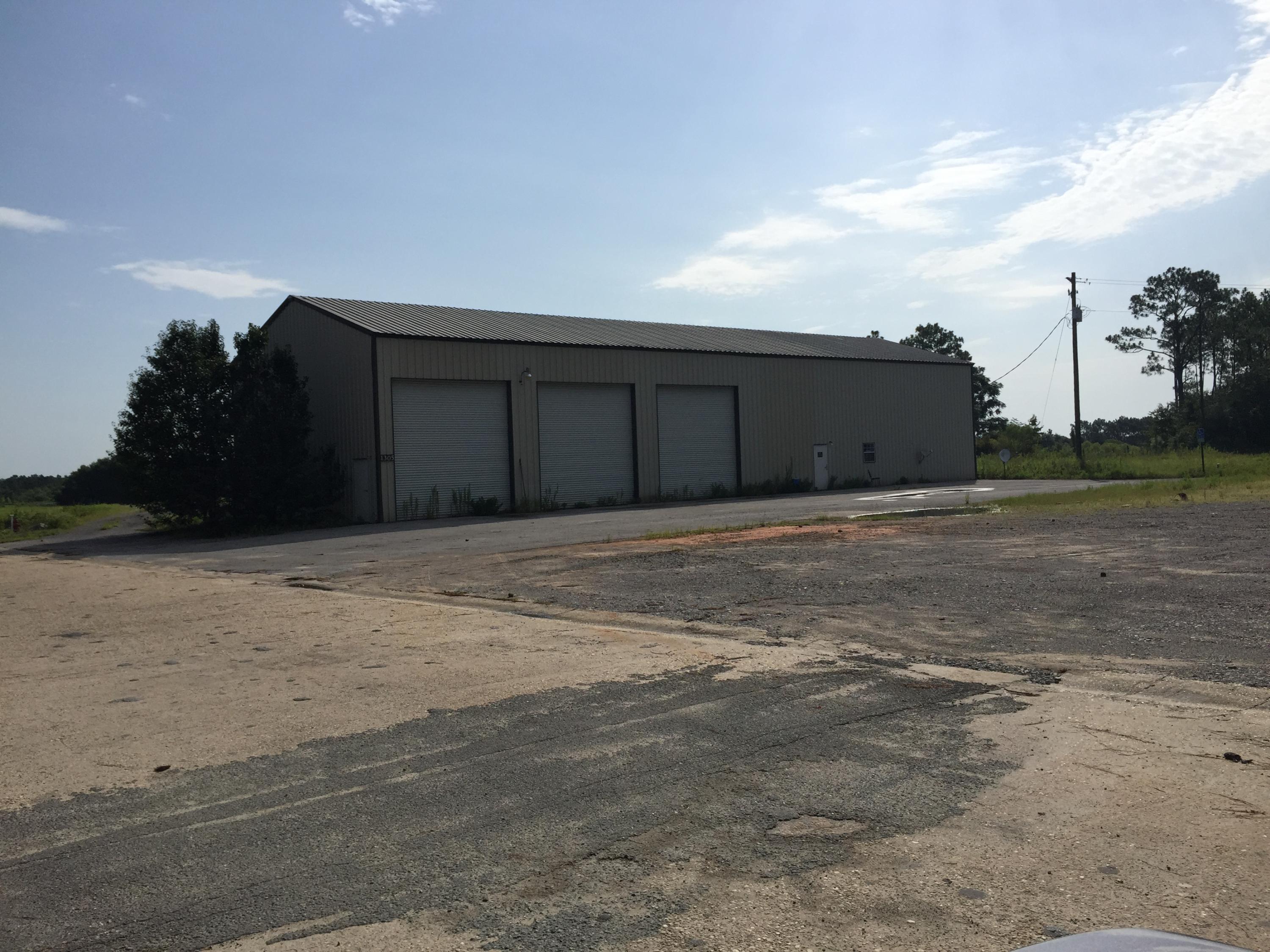 55 acres zone Heavy Industrial, Non-Restrictive Use. Located within Okaloosa County, this property is adjacent to Anderson Columbia with easy access to I-10 and all areas of the county. 4800sqft warehouse located at entrance. 5 rollup doors at 14' include two drive through and one bay door. 300sqft office and restrooms in warehouse.Parcel ID 303N24000000050000 also included.