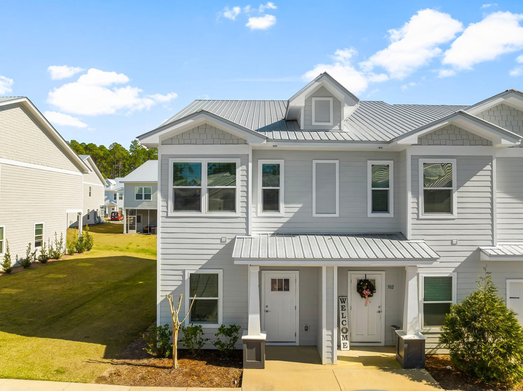 Beautiful End unit with one of the largest floor plans. Quiet tranquil setting, relaxed lifestyle with the luxury of the beautiful white sandy beaches 12 minutes South. Covered and fully screened-in back porch area, quartz counter tops, LVP flooring and carpet throughout, all stainless appliances, mini blind window coverings, community pool, 3 beds, 2.5 baths.Community offers a full playground and pickle ball courts as well as a beautiful community pool and gathering area. Bring all offers...