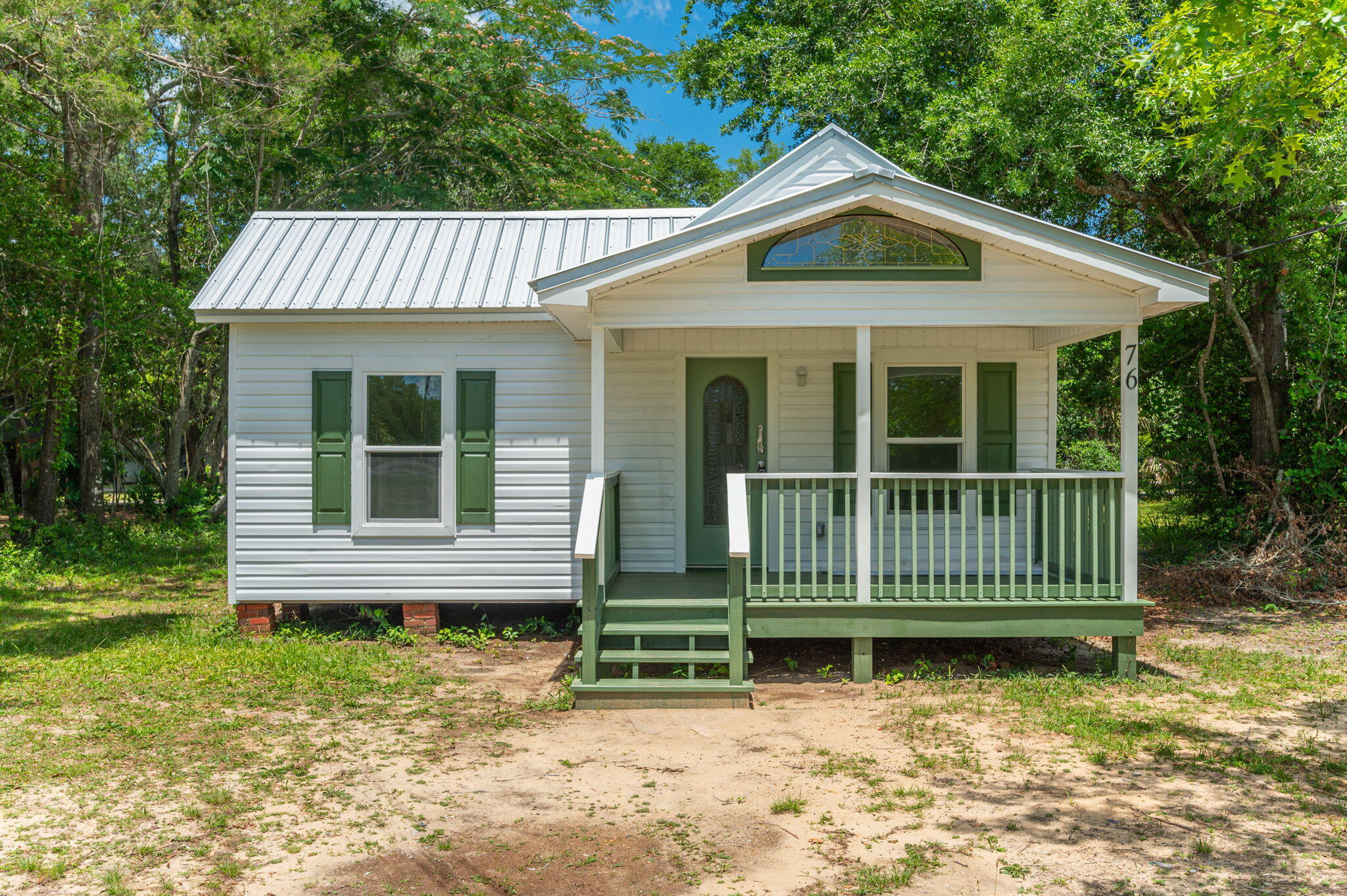 Welcome to this charming one-bedroom with an office space, two-bathroom fully renovated historic Florida cottage, Nestled in the heart of DeFuniak Springs, this home combines modern amenities with timeless charm.As you enter, you're greeted by a spacious living area with plenty of natural light, perfect for relaxing or entertaining guests. The renovated kitchen features new appliances, ample cabinet space, a center island and fireplace! The primary bedroom offers a comfortable retreat with an en-suite bathroom. Washer & Dryer is included! Outside, you'll find a lovely backyard space, perfect for enjoying Florida's sunny days or hosting BBQs with friends and family. Application required.