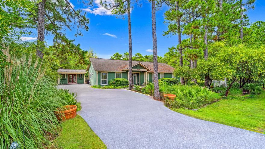One mile from the beach, this three-bedroom, two-bath retreat rises 30+ feet above sea level on a rare oversized lot, an elevated vantage point that few properties in the area can claim. Behind the home, protected state forest land stretches endlessly, ensuring permanent privacy, quiet mornings, and unspoiled views.No HOA means no limits. Add a pool, expand your living space, or craft a backyard escape that's all your own. Two matching outbuildings extend your possibilities, one fully insulated with heating and cooling, ready to serve as an art studio, workshop, or home office.  This is more than a home. It's a blank canvas of coastal living with nature at your back door and the Gulf just steps away. Enjoy the convenience of having Gulf Place Town Center, and restaurants such as Shunk Gully, Shelby's, shopping, and more just 1 mile away. Contact us today for a private showing.