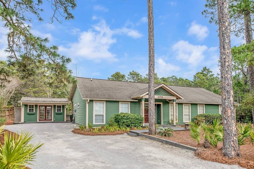 One mile from the beach, this three-bedroom, two-bath retreat rises 30+ feet above sea level on a rare oversized lot, an elevated vantage point that few properties in the area can claim. Behind the home, protected state forest land stretches endlessly, ensuring permanent privacy, quiet mornings, and unspoiled views.No HOA means no limits. Add a pool, expand your living space, or craft a backyard escape that's all your own. Two matching outbuildings extend your possibilities, one fully insulated with heating and cooling, ready to serve as an art studio, workshop, or home office.  This is more than a home. It's a blank canvas of coastal living with nature at your back door and the Gulf just steps away. Enjoy the convenience of having Gulf Place Town Center, and restaurants such as Shunk Gully, Shelby's, shopping, and more just 1 mile away. Contact us today for a private showing.