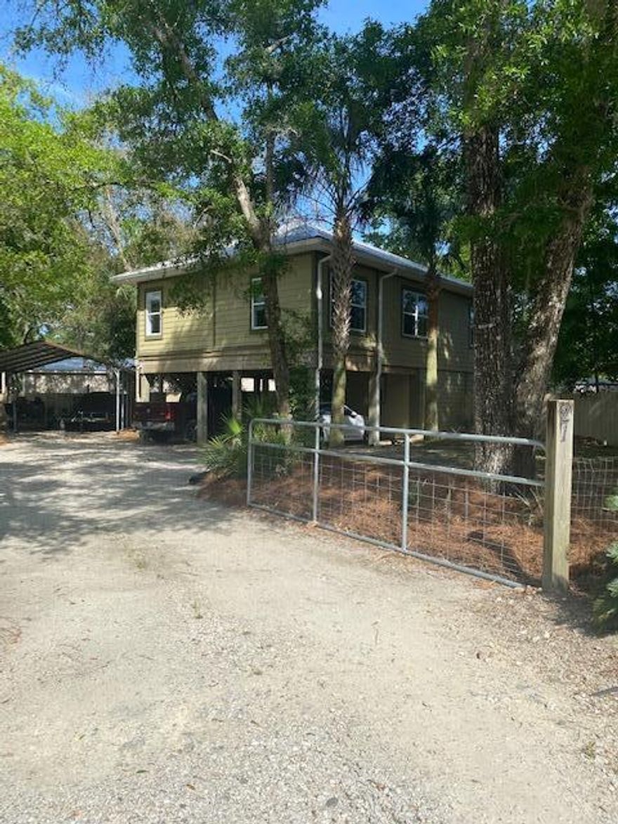 Welcome to your new  Beach or River Cottage!  15 mins to the beach and 3 mins to the Choctawhatchee River system. Large, .35 acre corner lot in fast growing Black Creek area.  Wide open floor plan, 9ft ceilings, 2 Bed/1 Bath upstairs and newly remodeled 400sq ft flex space downstairs w/remodeled full bath (new cabinets & countertops). Upgrades include remodeled kitchen 2022 w/quartz countertops & stainless steel  Whirlpool appliances. New Mini-split ductless HVAC and tankless water heater downstairs.  New septic field 2020. Lots of extra exterior living and storage, 26x10 privacy deck w/outdoor shower and brand new 8x12x7 storage shed.  Bring your dog to the fully fenced front and back yards. Bring the boats, jet skis or other toys too.  No HOA and its in Flood Zone X! 4 Large Carport spaces with circular drive and 5 boat ramps within 20 minutes: Black Creek 3mins, Grady Brown 10 mins, Pilcher Park 10 mins, Marse Landing 15 min,  & Hogtown Bayou 20mins. Don't wait on this one!