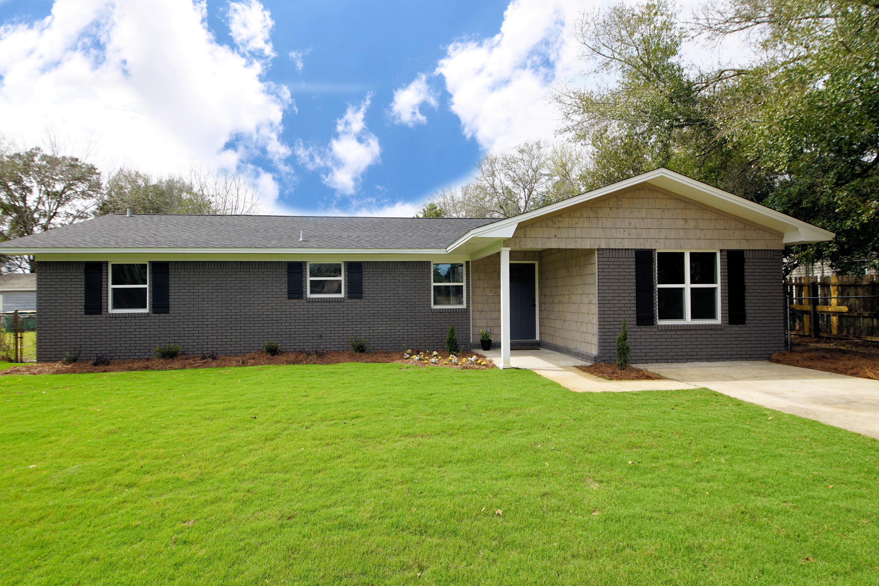 Completely renovated all-brick home in the center of Fort Walton Beach, FL. Located close to beaches, shopping, and restaurants! This 4 bedroom, 2 bath home has 1614 square feet and features a new 30-year dimensional shingle roof, new windows, kitchen, bathrooms, flooring, and so much more! This home has a modern design with a cozy farmhouse twist! Enter the home through the new front door and notice the open floor plan with the kitchen opening to the dining and living room! The kitchen has gray, shaker style, custom cabinetry to the ceiling with oil rubbed bronze hardware! There is an island that seats 2-3 with a butcher block counter top and the remaining countertops are white quartz! The farmhouse sink is perfectly positioned under a window that overlooks the newly sodded front yard!