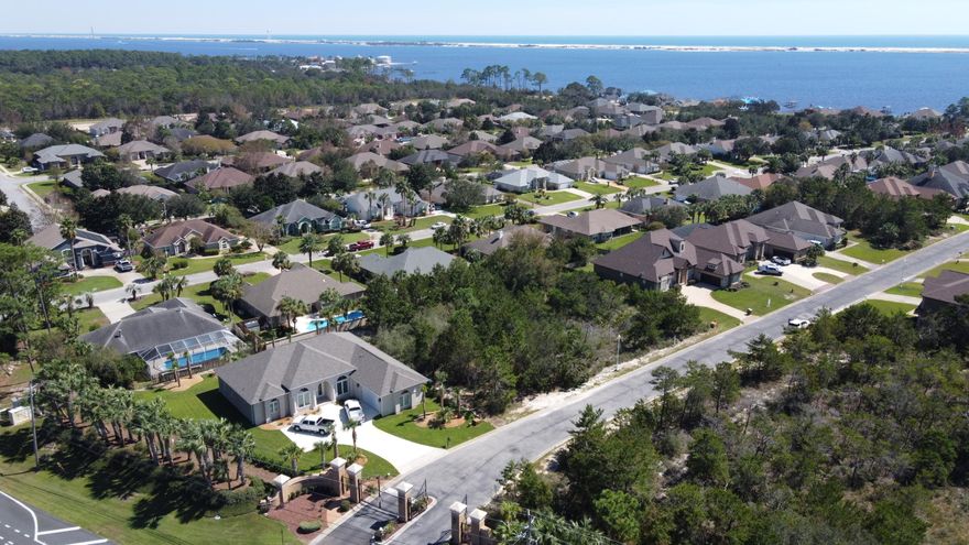 Private homesite located in the prestigious La Fontaine gated community. This interior lot features deeded WATER ACCESS to the Santa Rosa Sound with community gazebo and sandy beach.Located only minutes to the white sandy beaches of the Emerald Coast at Navarre Beach and the Navarre Fishing Pier, great schools, retail shopping and restaurants. Convenient to the Destin-Fort Walton Beach Airport, Hurlburt AFB and Eglin AFB and only 30 minutes to Gulf Breeze or Destin.