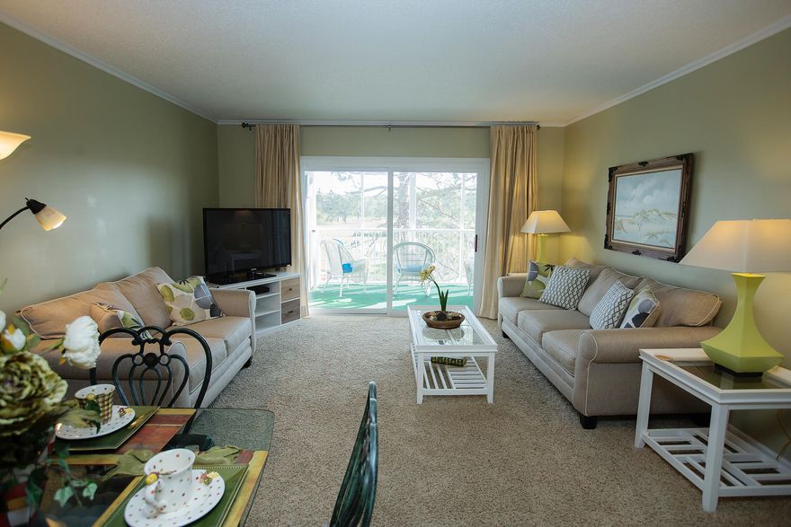 Primary, secondary or long term rental investment property!! Enjoy your morning coffee relaxing on the screened in balcony with a spectacular view of the pool, pond and golf course. All appliances have been upgraded to stainless steel with new lower cabinets and counter tops. New vinyl windows and sliding doors on balcony. This well maintained and beautifully decorated unit is turn key ready for the new owner!!