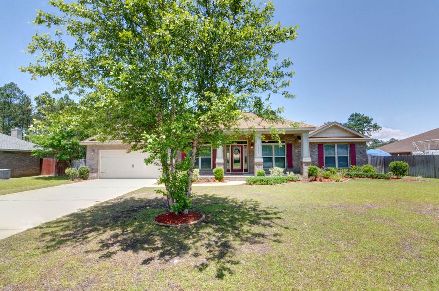Welcome home to this stunning Gooden Homes craftsman style retreat perfectly located on a dead end street on the east side of Holley by the Sea! This spacious layout features 4 bedrooms, 2.5 baths, plus a separate formal dining room/flex space on a sprawling half acre lot! Pull up in the long driveway and appreciate the large covered front patio, and walk inside to enjoy a great entryway with 8-10ft ceilings throughout with crown molding in the living areas and wide baseboards throughout. The great sized living room showcases a fireplace with huge sliding doors overlooking the expansive backyard, and is open to the fantastic kitchen! A baker's delight with custom wood cabinets, stainless appliances, and plenty of granite counter space with an eat in kitchen area - you will enjoy making food and memories in this space! The master bedroom is a fantastic oasis with a trey ceiling with crown molding (as well as doors leading to the covered patio) and a master bathroom with double granite vanities, a separate soaking tub, and tiled shower. The other three bedrooms are great sized with a full bathroom, also with granite counters, matching custom cabinets, and bronze fixtures. The large laundry room features a utility sink and another door that leads to the large covered patio. With the home on city sewer and no septic tank to worry about have plenty of room to put in a pool in the huge fenced in back yard! Don't miss out on this gem!