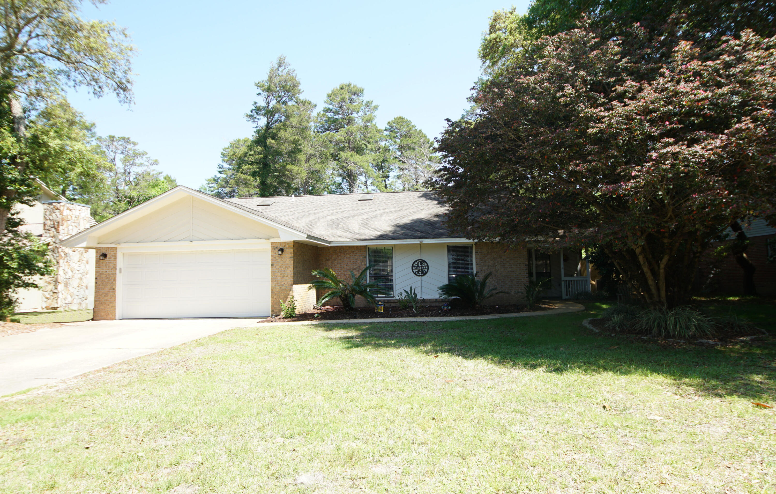 This home was completely refurbished in 2014 including the roof, flooring, tile, vanities, faucets, toilets, appliances, and many other features, but the new owners decided to give this house the WOW factor and make it a home that says, WOW.   Enjoy your night and days  lounging on the deck of your heated fiberglass pool with a hot tub. Entertain guests and family in your outdoor kitchen.  Double fenced back yard with enough room behind the fence to build a multi car garage or a work shop and store all your outdoor toys!  Inside they took it further and replaced the counter tops with granite and a new back splash and renovated both bath rooms. New lighting along with a projector TV over the fireplace that conveys along with the Murphy Bed in one of the bedrooms. New AC 2021.