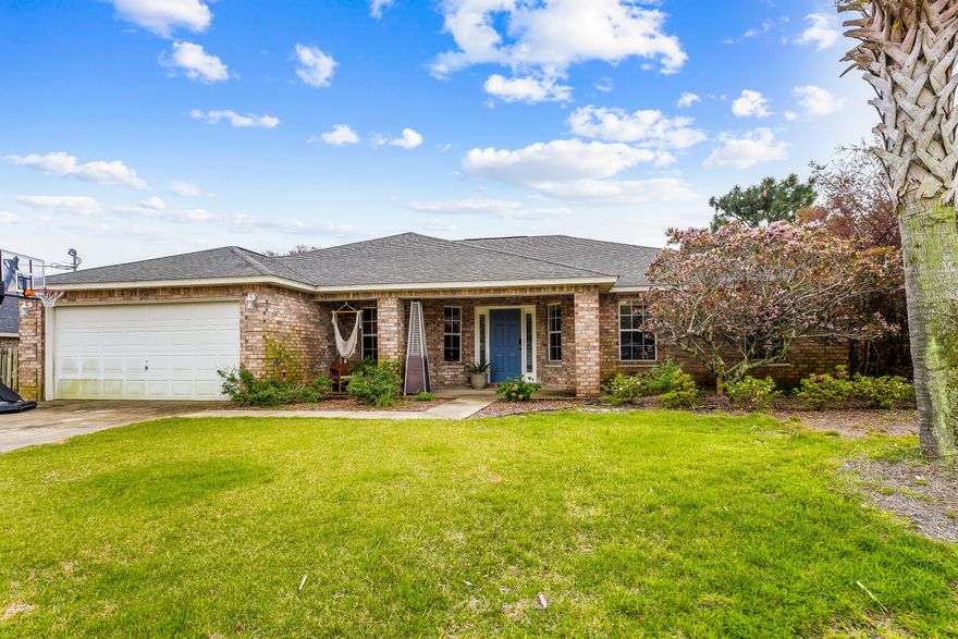 Holley By The Sea! All brick 4/2 home that is move in ready waiting for your family. This open concept home features high ceilings, recessed lighting, wood laminate flooring in the living room, dining room, office, and master bedroom. As you enter the home you will notice a stunning wall of built-in shelving in the office, and a formal dining room opposite. The living room is spacious and has 2 french doors that offer natural light and access to the patio and pool. The kitchen has a breakfast bar with quran countertops, pantry and tile flooring. The master suite has double french doors that walk out to the patio/pool, plenty of space for a king size bed and the master bathroom has a soaker tub and separate walk in shower. The large backyard has a privacy fence, shed and a screened in pool.