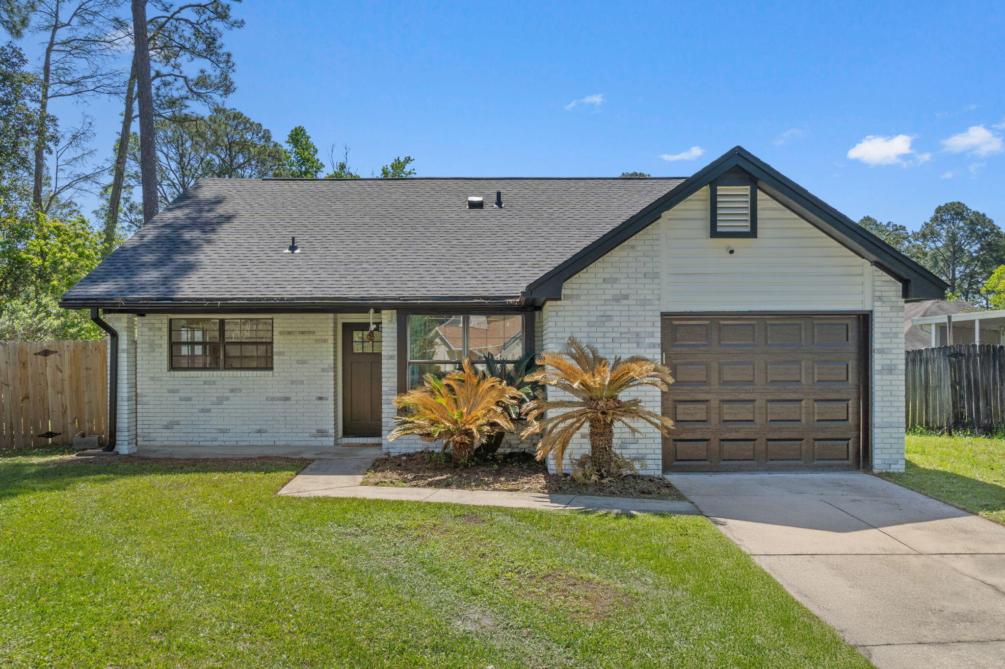 Welcome to 2106 Wilderness Path - a cozy and inviting 3-bedroom, 2-bathroom home that offers both comfort and convenience in the heart of Fort Walton Beach. Step inside to discover a modern kitchen outfitted with stainless steel appliances, perfect for whipping up your favorite meals. The open layout is enhanced by tall ceilings and an abundance of natural light, giving the home a bright and spacious feel. Washer and dryer hookups are available, providing flexibility for in-home laundry. The home also features a one-car garage, ideal for parking or additional storage needs. Enjoy the outdoors in your fully fenced backyard - perfect for entertaining, gardening, or letting pets roam freely. Located in a prime area, this home offers easy access to shopping, dining, schools, and the beautiful beaches of the Emerald Coast. Whether you're a first-time homebuyer, an investor, or looking to downsize, this home is a fantastic opportunity. Don't miss your chance to make 2106 Wilderness Path your new address!